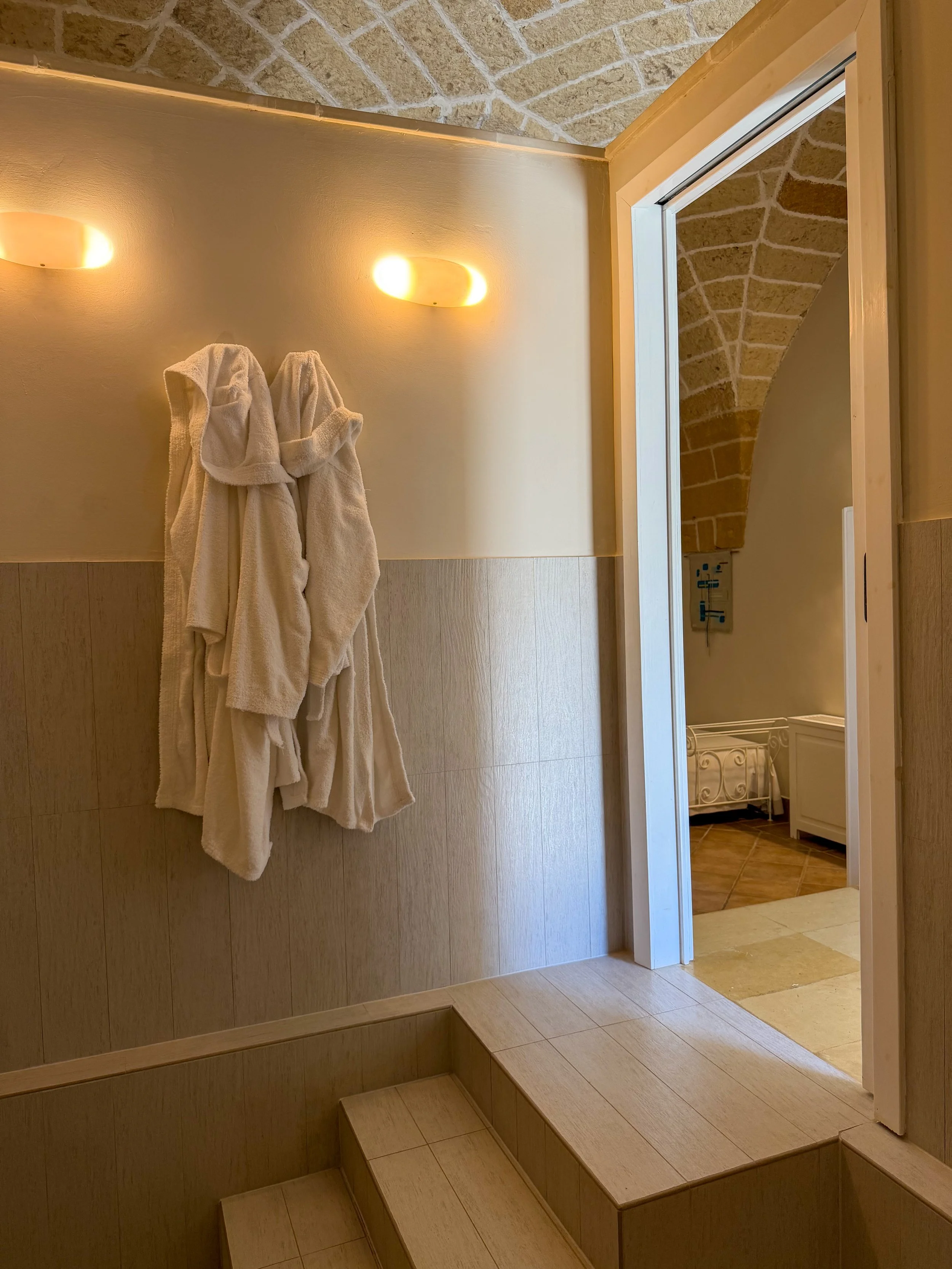 Modern bathroom with soft lighting and direct access to the elegant guest room