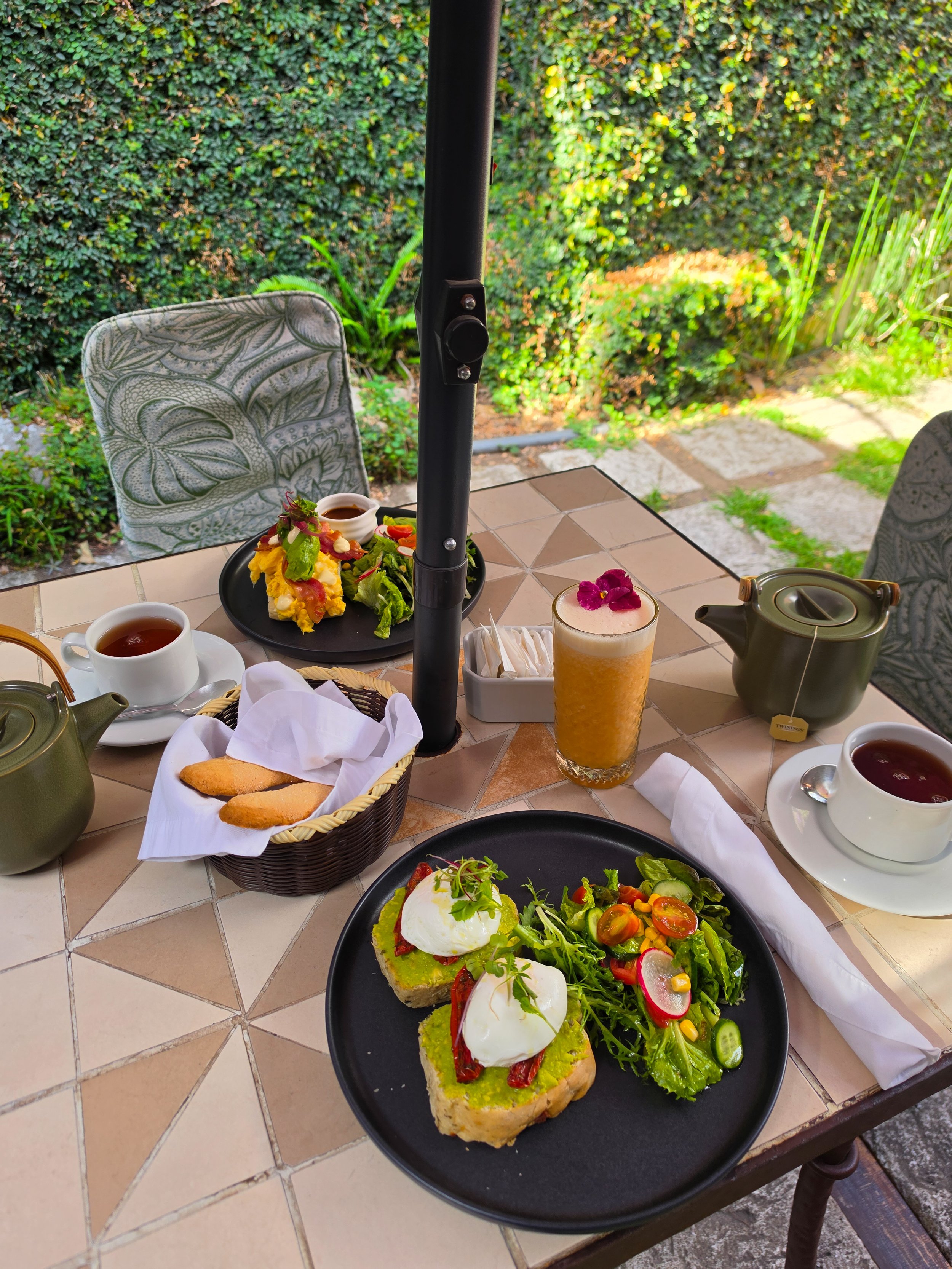 Fresh breakfast served in a peaceful garden courtyard