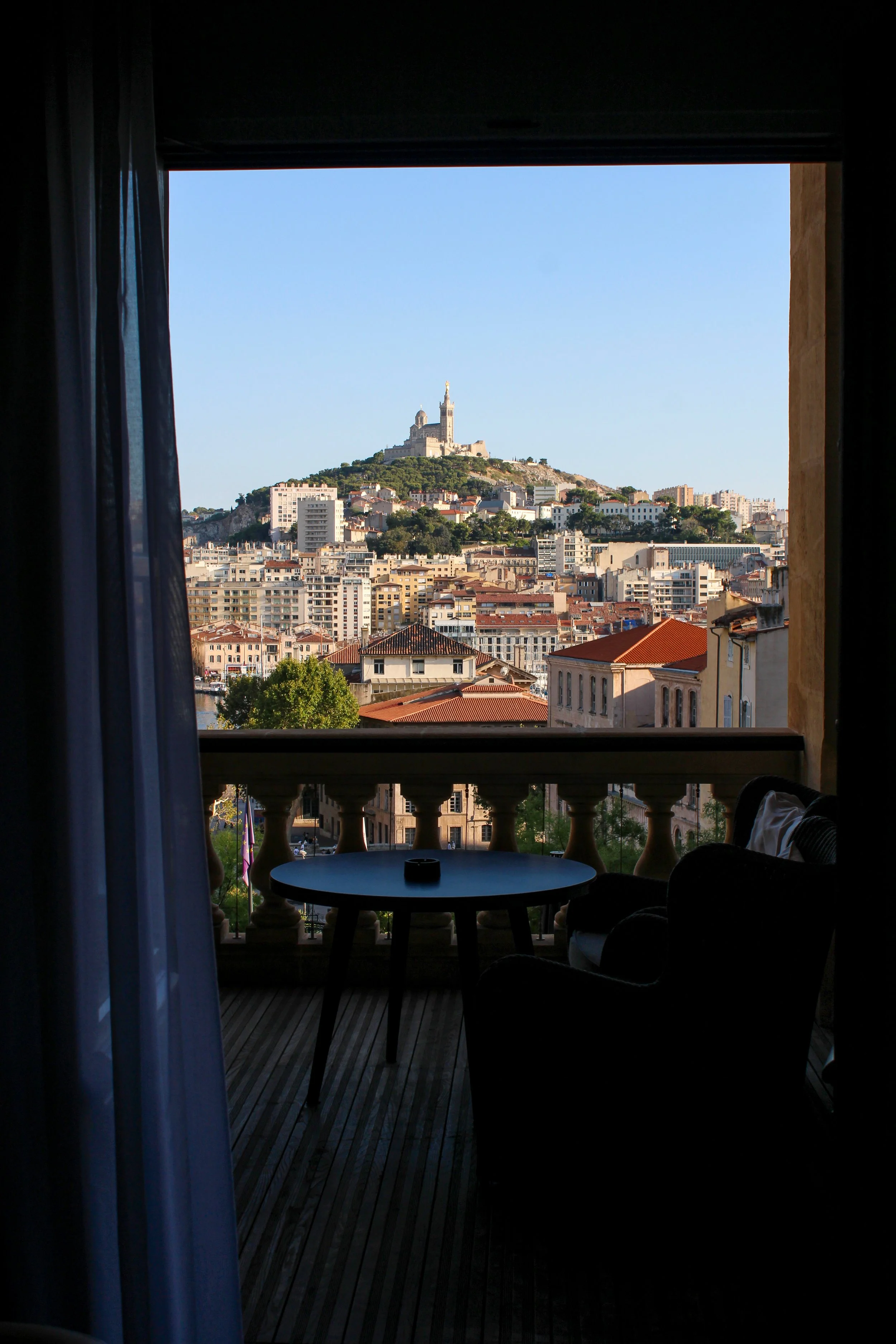 Private terrace framing panoramic views of Notre-Dame de la Garde