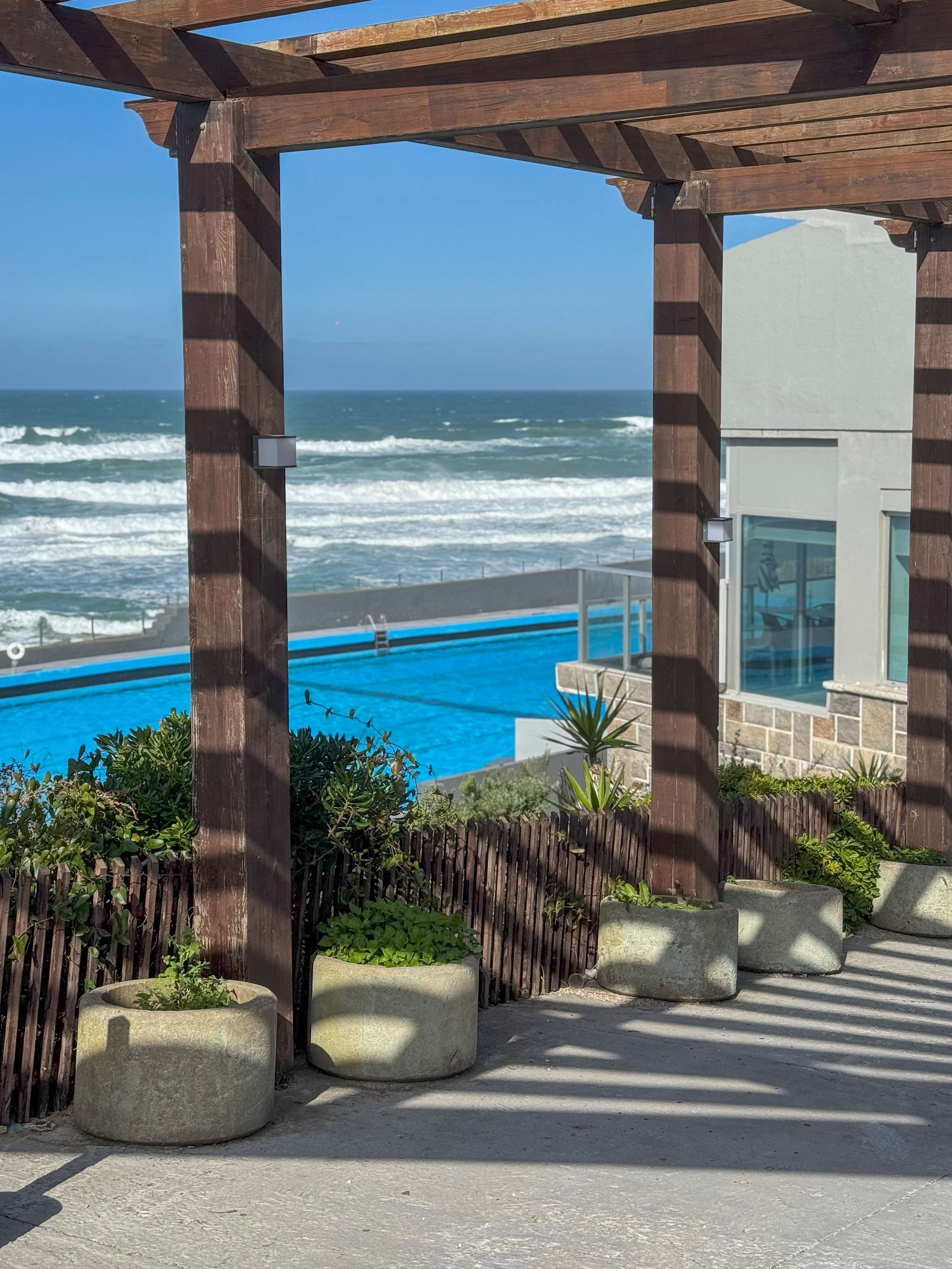 Pergola walkway overlooking the iconic seawater pool and Atlantic Ocean at Arribas Hotel
