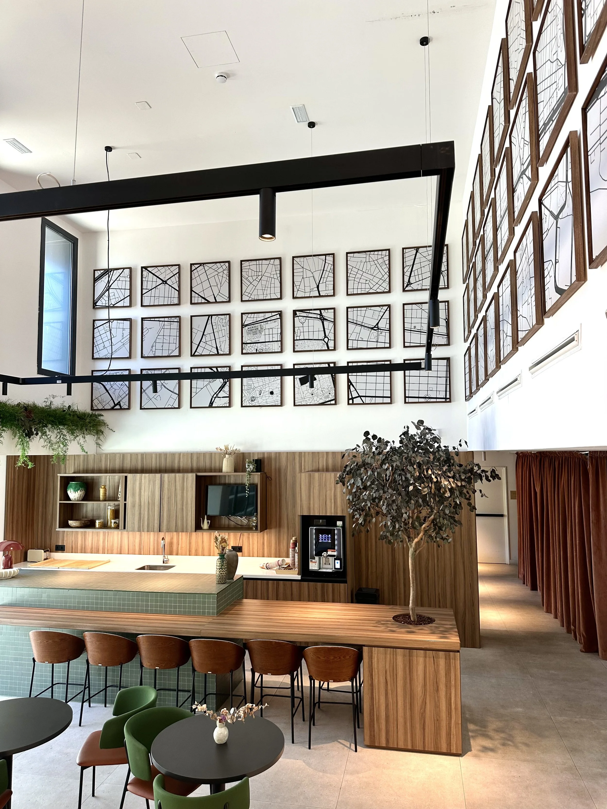 Open plan communal kitchen and social space with modern interiors