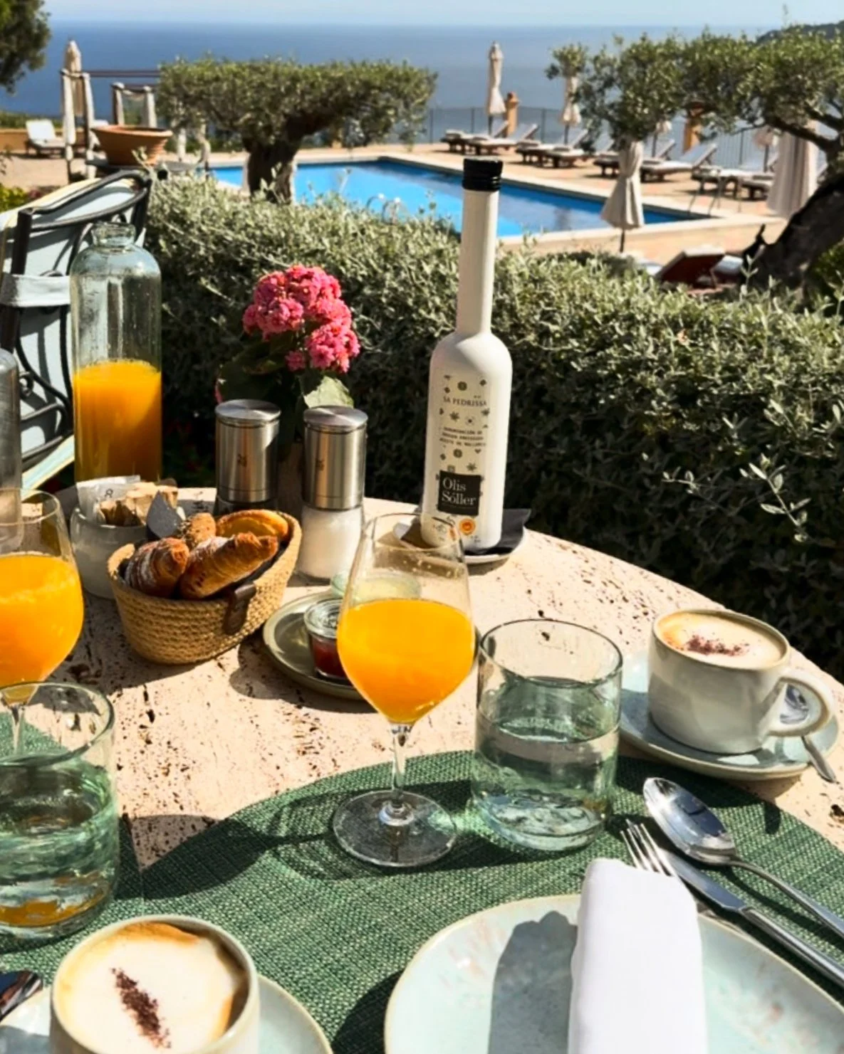 Mediterranean breakfast with fresh pastries, coffee and sea views beside the pool at Sa Pedrissa, Deià, Mallorca