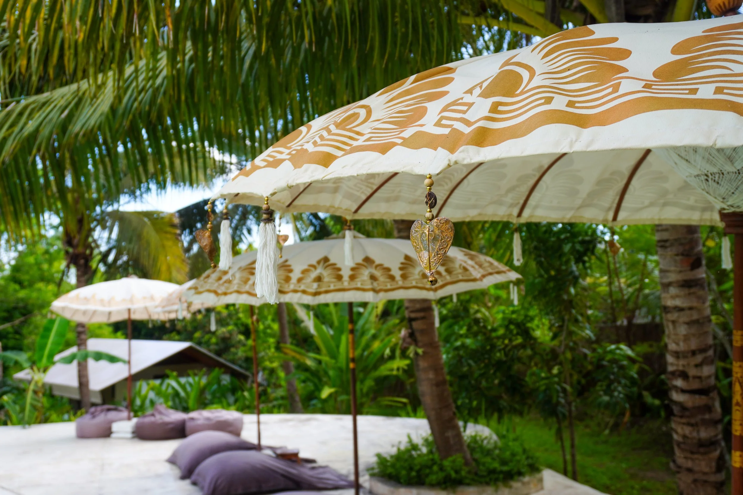 Handcrafted parasols and soft textures create a serene, sun-dappled retreat in the heart of the tropics, Autentik Penida – Nusa Penida, Bali.