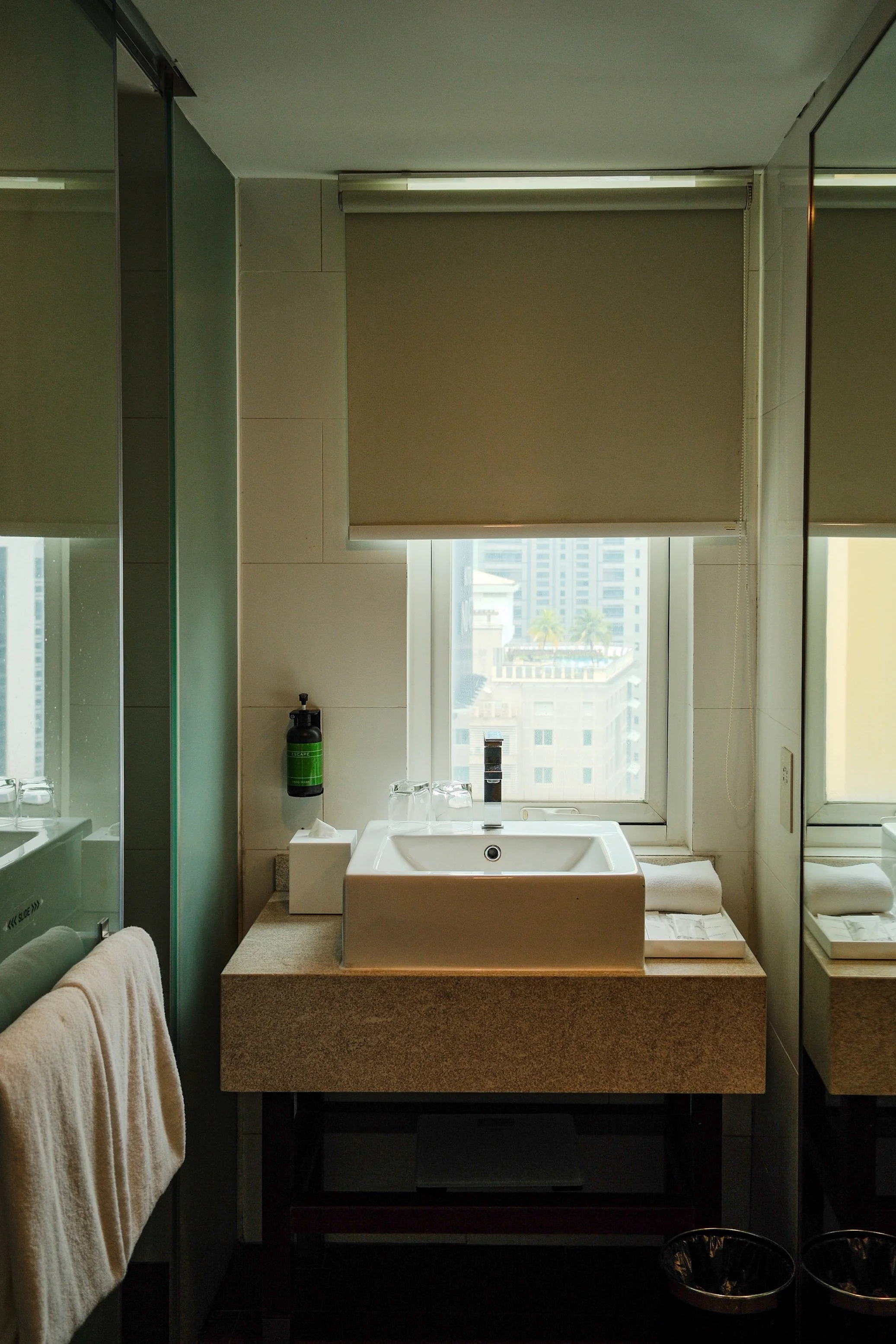 Bright bathroom with contemporary finishes and city views