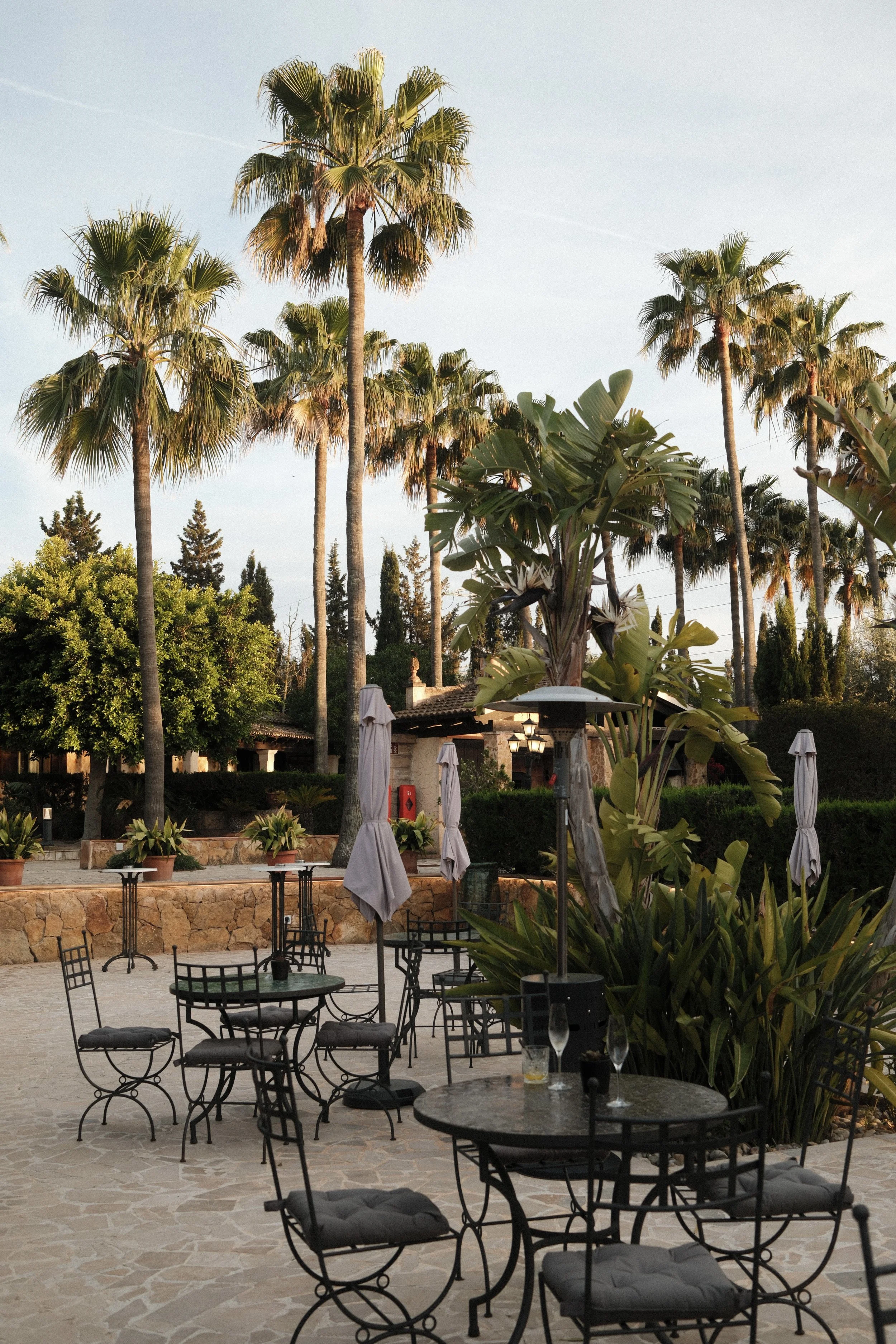 Outdoor terrace surrounded by Mediterranean gardens at Son Molí Country House