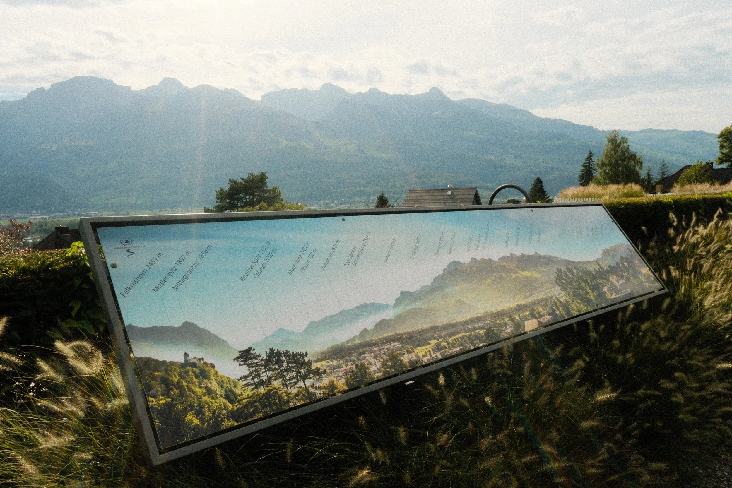 Panoramic viewpoint overlooking Vaduz with the Alps rising in the background