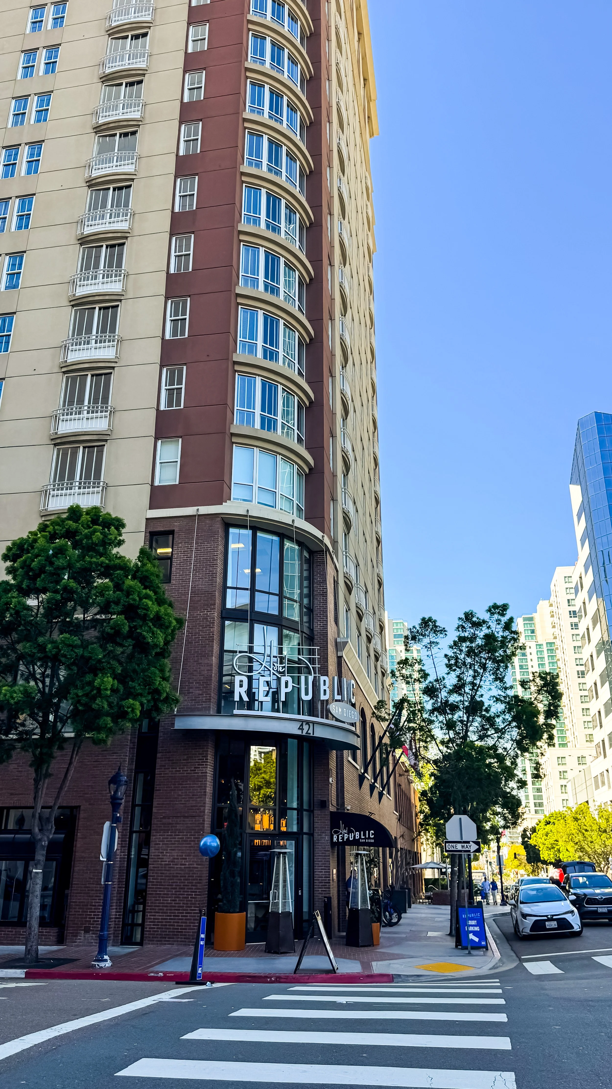 Exterior façade of the hotel with curved architecture and street-level entrance in downtown San Diego, Hotel Republic San Diego – San Diego, California.