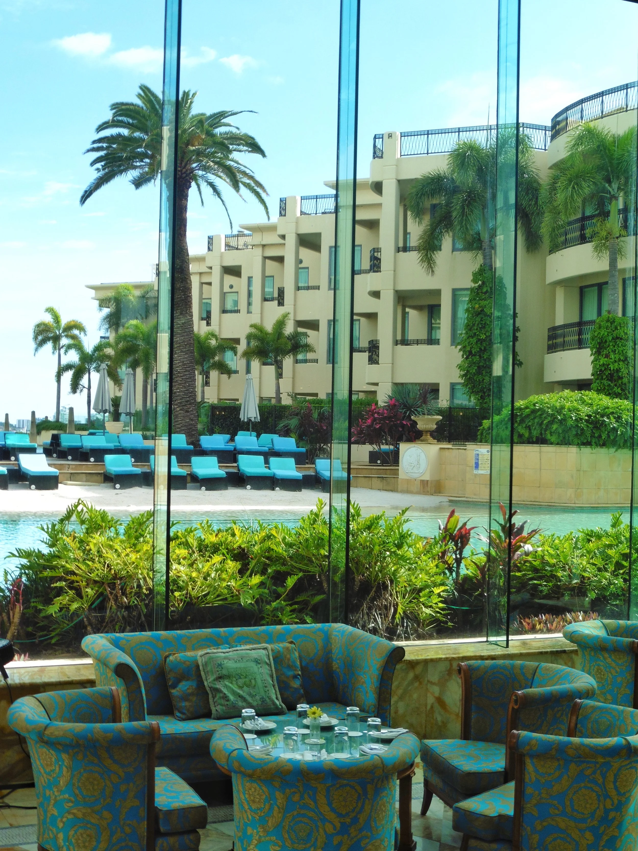 Luxury lounge overlooking the lagoon pool and tropical gardens at Imperial Hotel Gold Coast