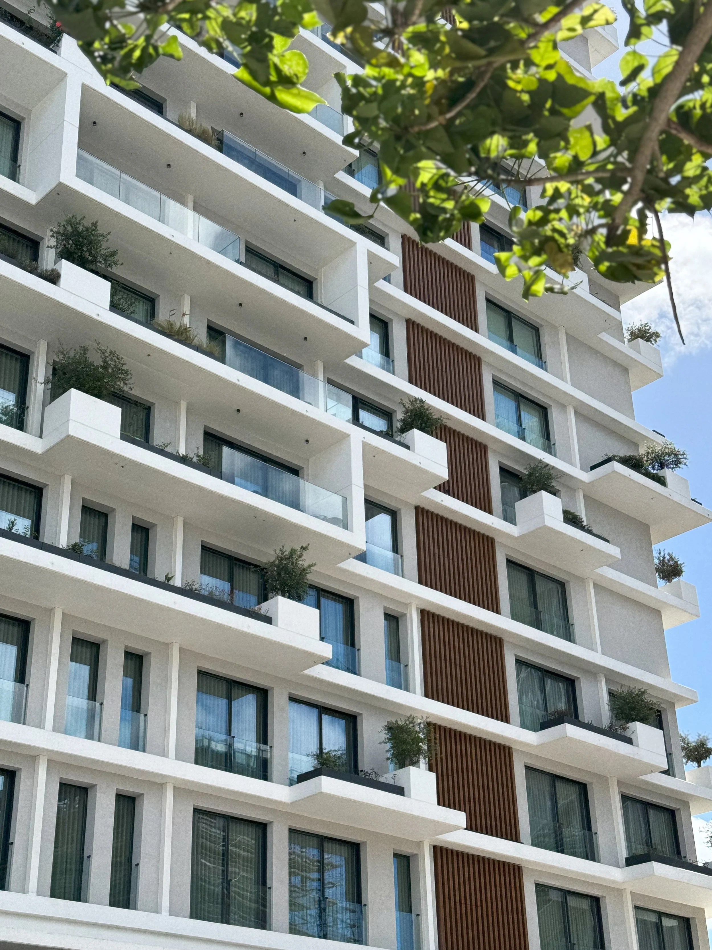 Modern façade of Martinhal Lisbon Oriente featuring contemporary architecture and private balconies