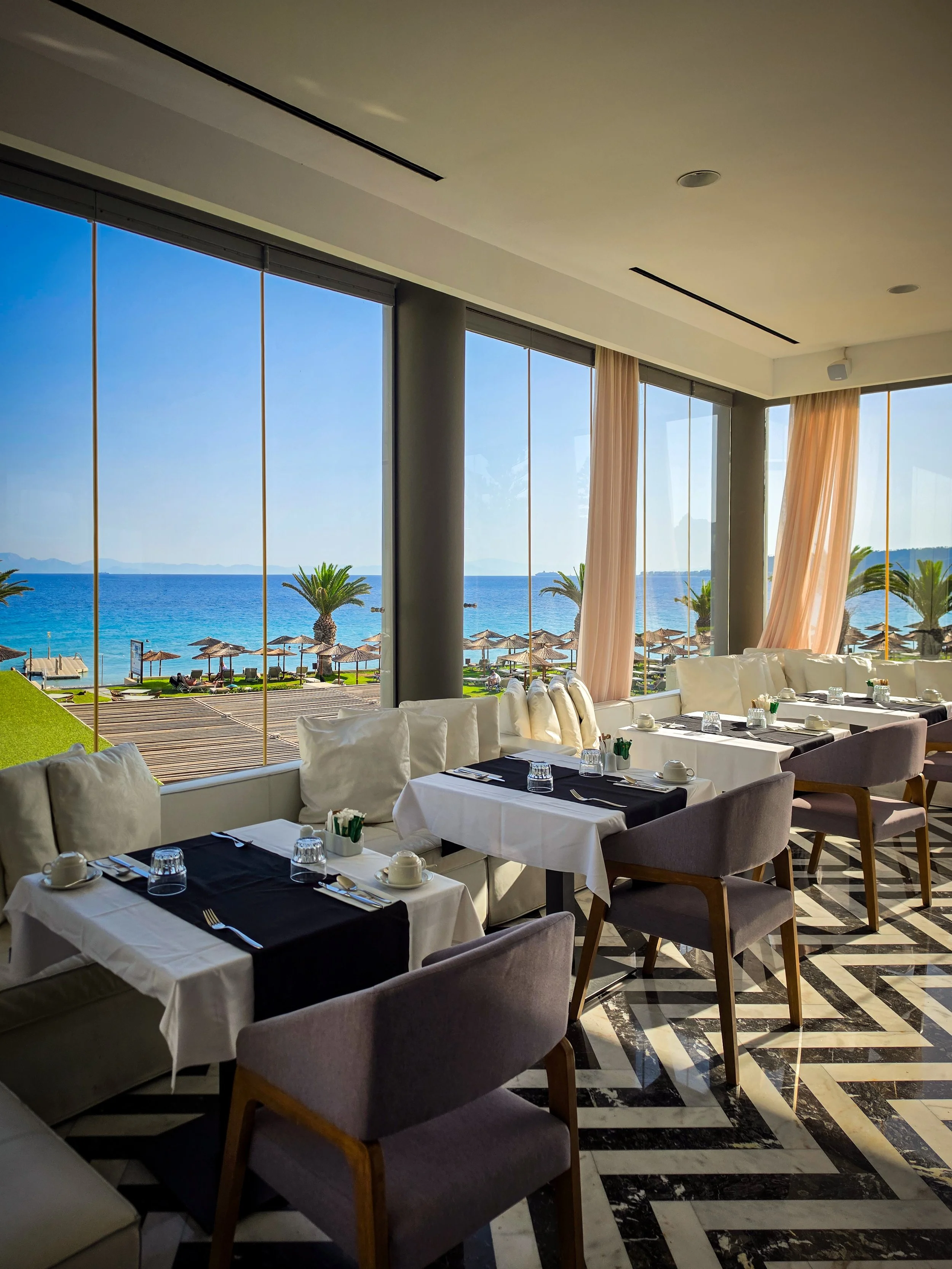 Elegant beachfront restaurant with panoramic Aegean Sea views