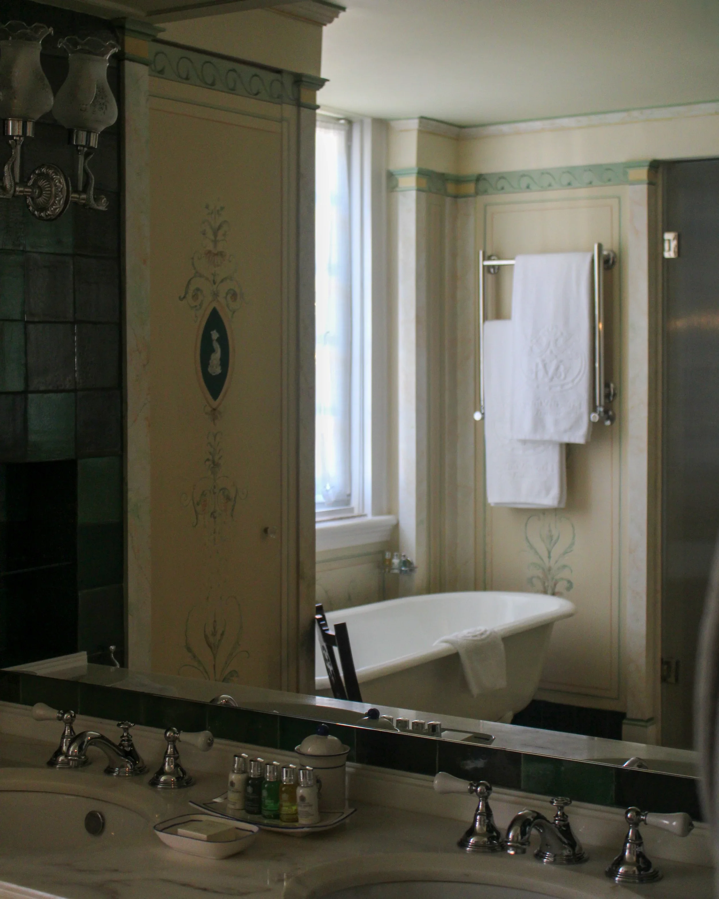 A freestanding bathtub and marble finishes create a timeless bathroom inspired by heritage design