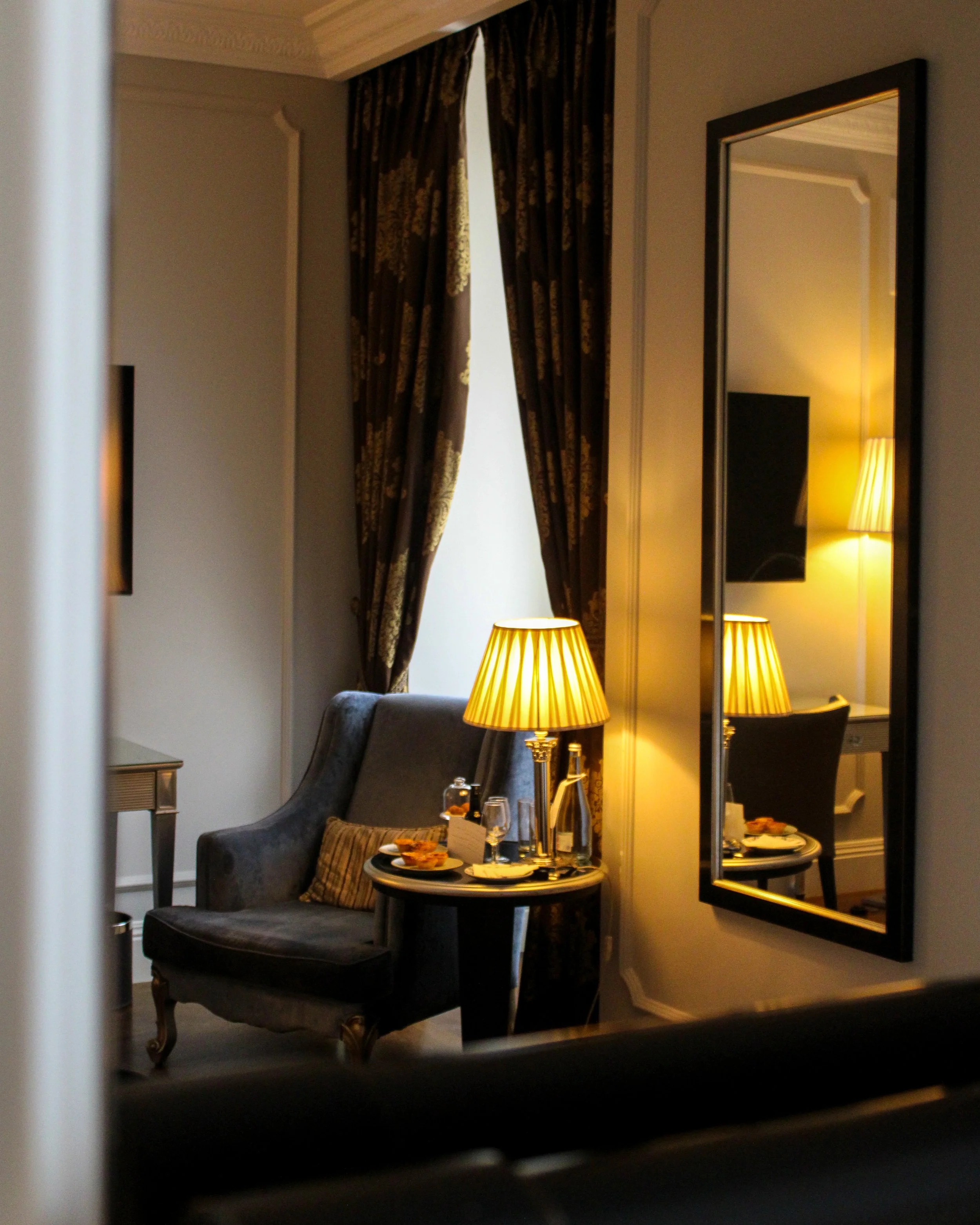 Elegant seating area with warm lighting and classic furnishings