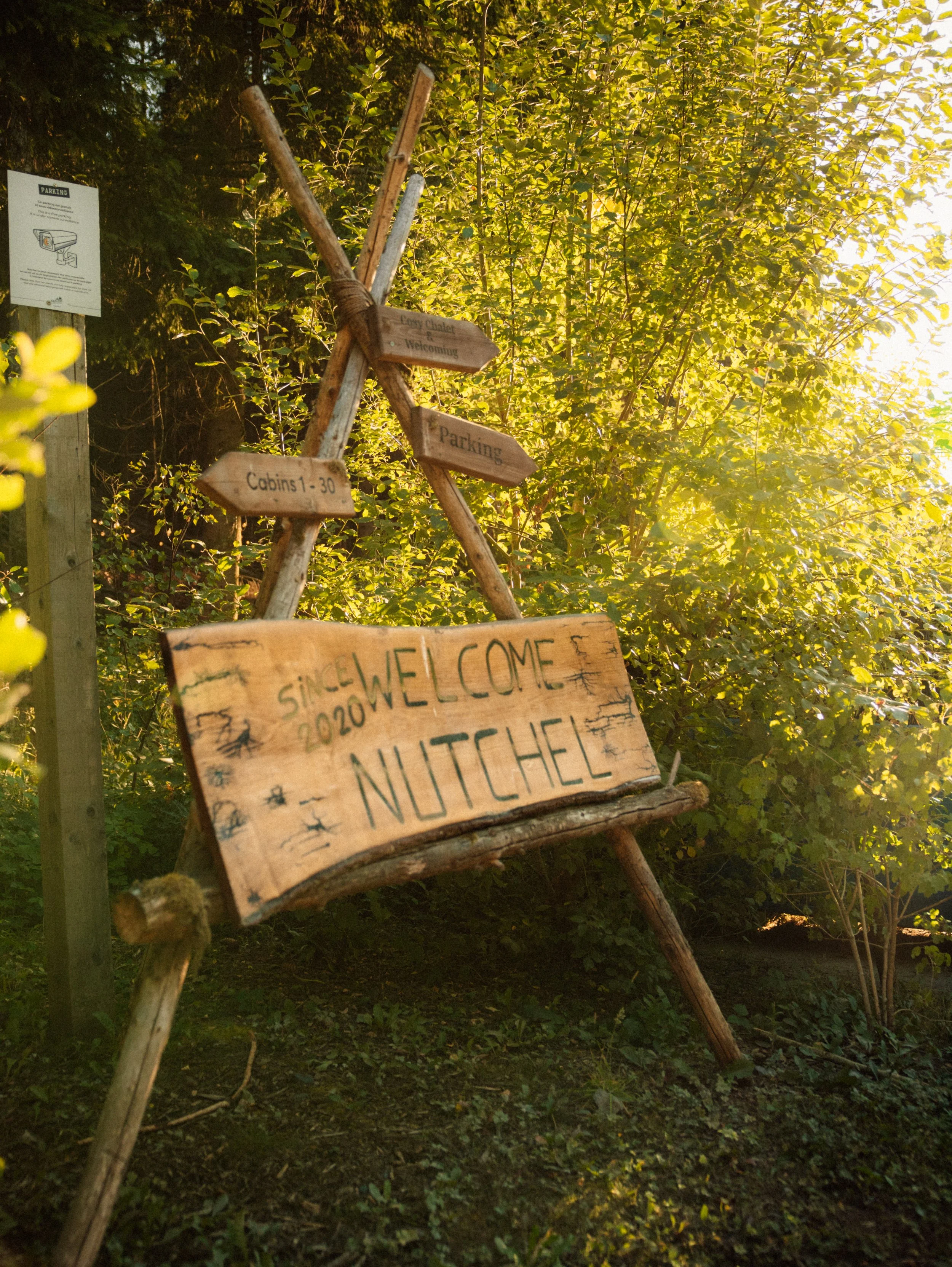 Welcome sign marking the entrance to the peaceful woodland retreat
