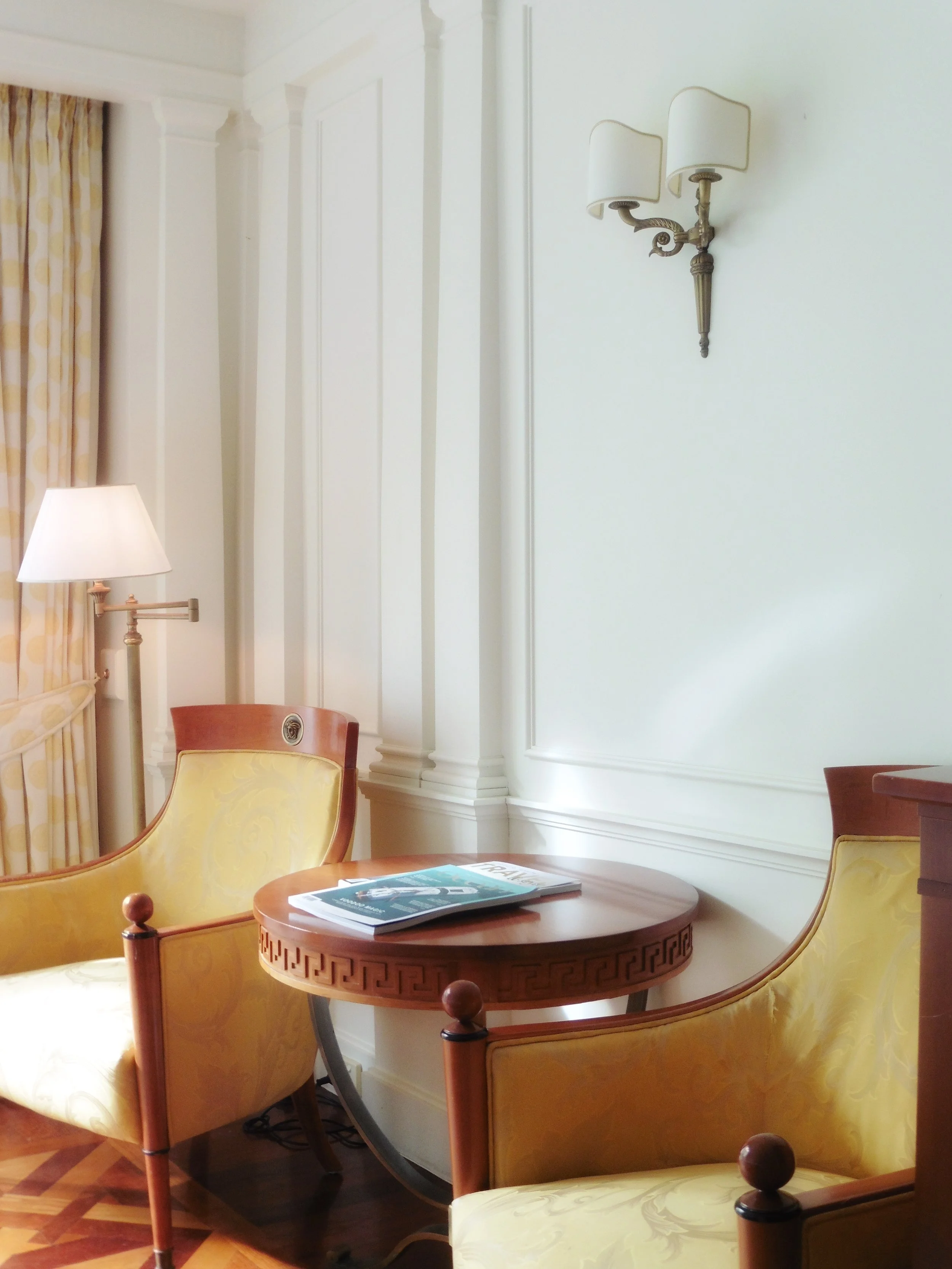 Sunlit lounge corner with custom furnishings and polished timber floors at Imperial Hotel Gold Coast