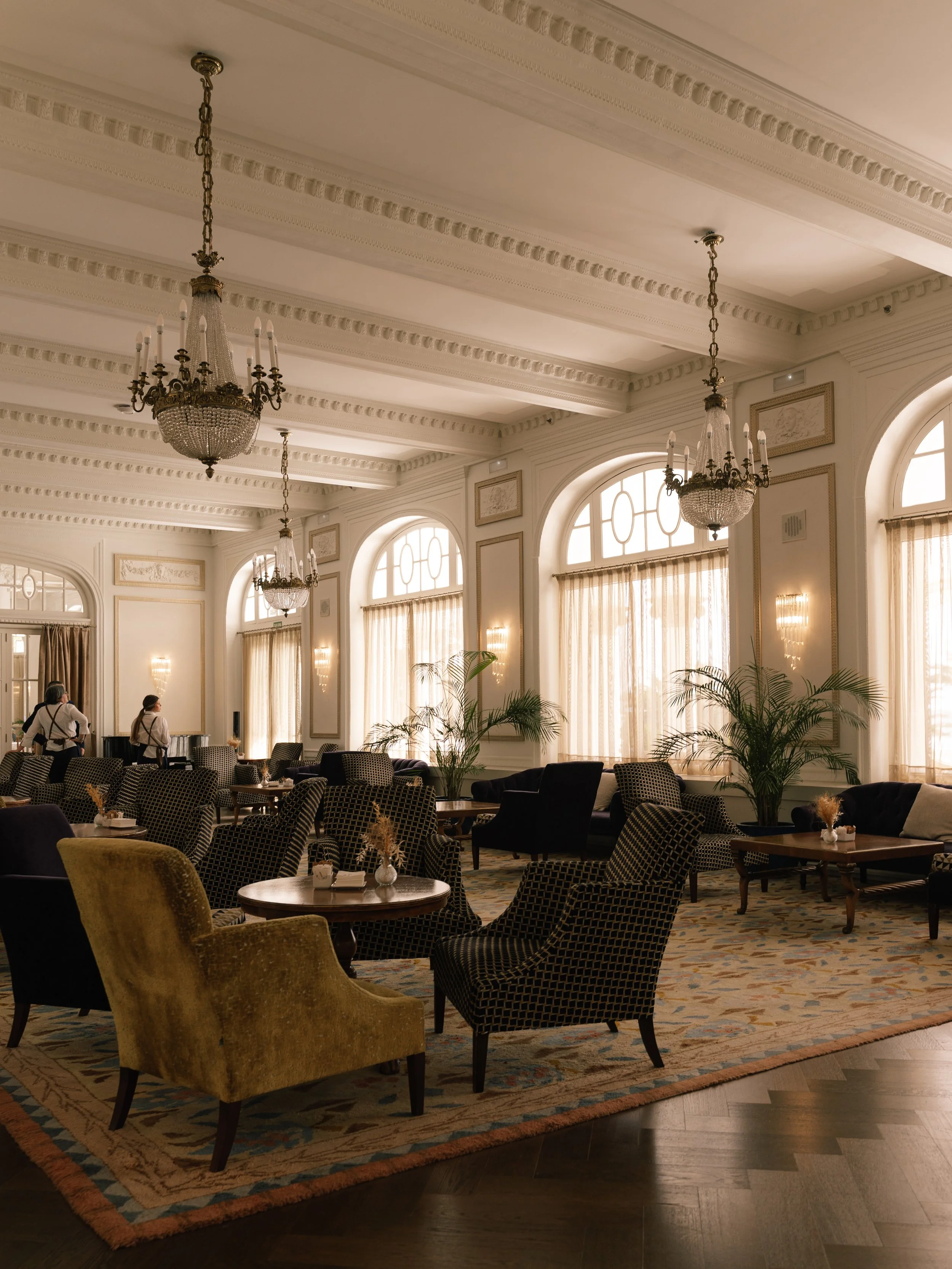 Historic lounge with crystal chandeliers and elegant seating areas