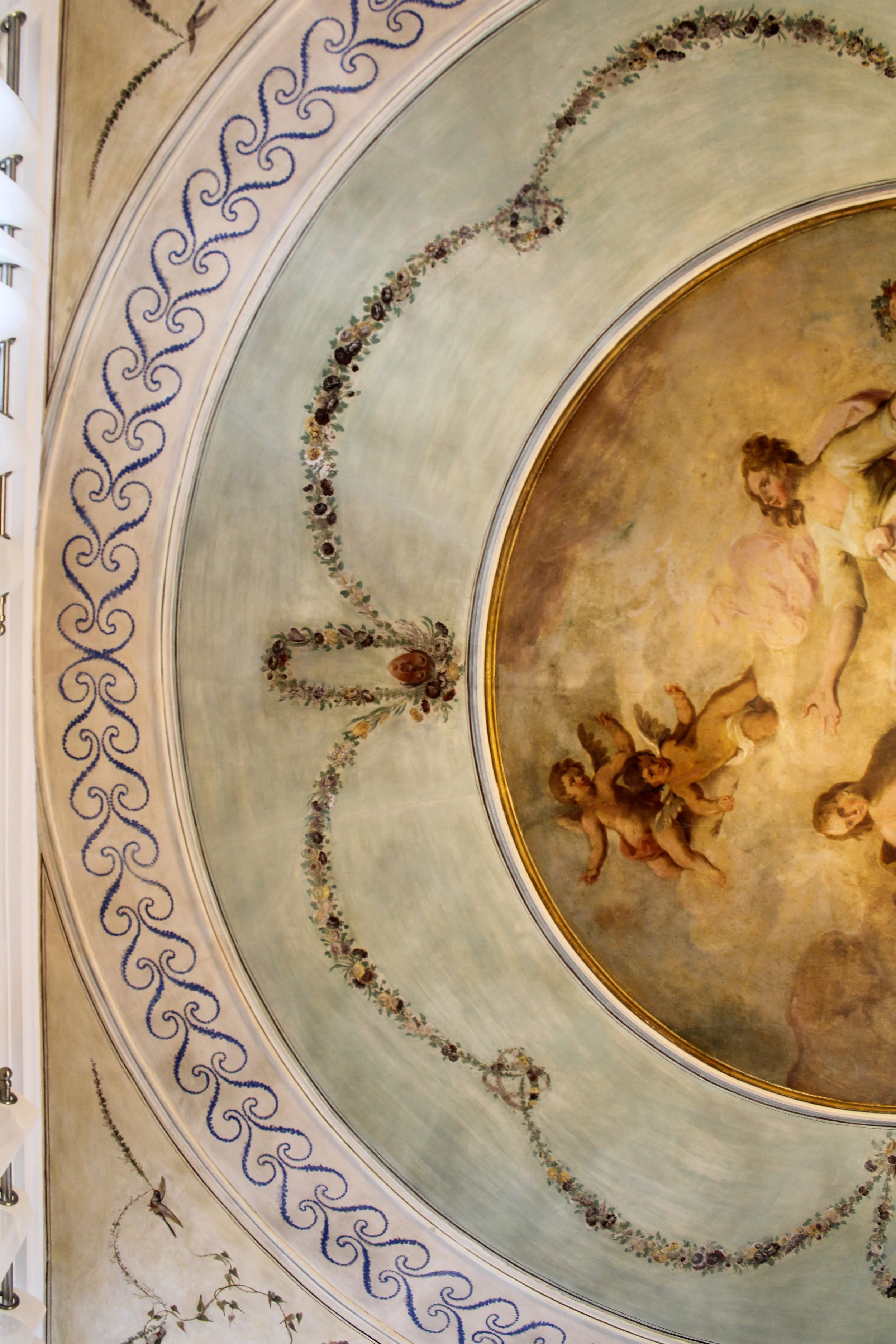 Hand painted fresco ceiling showcasing the historic character of Once Upon Lisboa in the heart of Lisbon