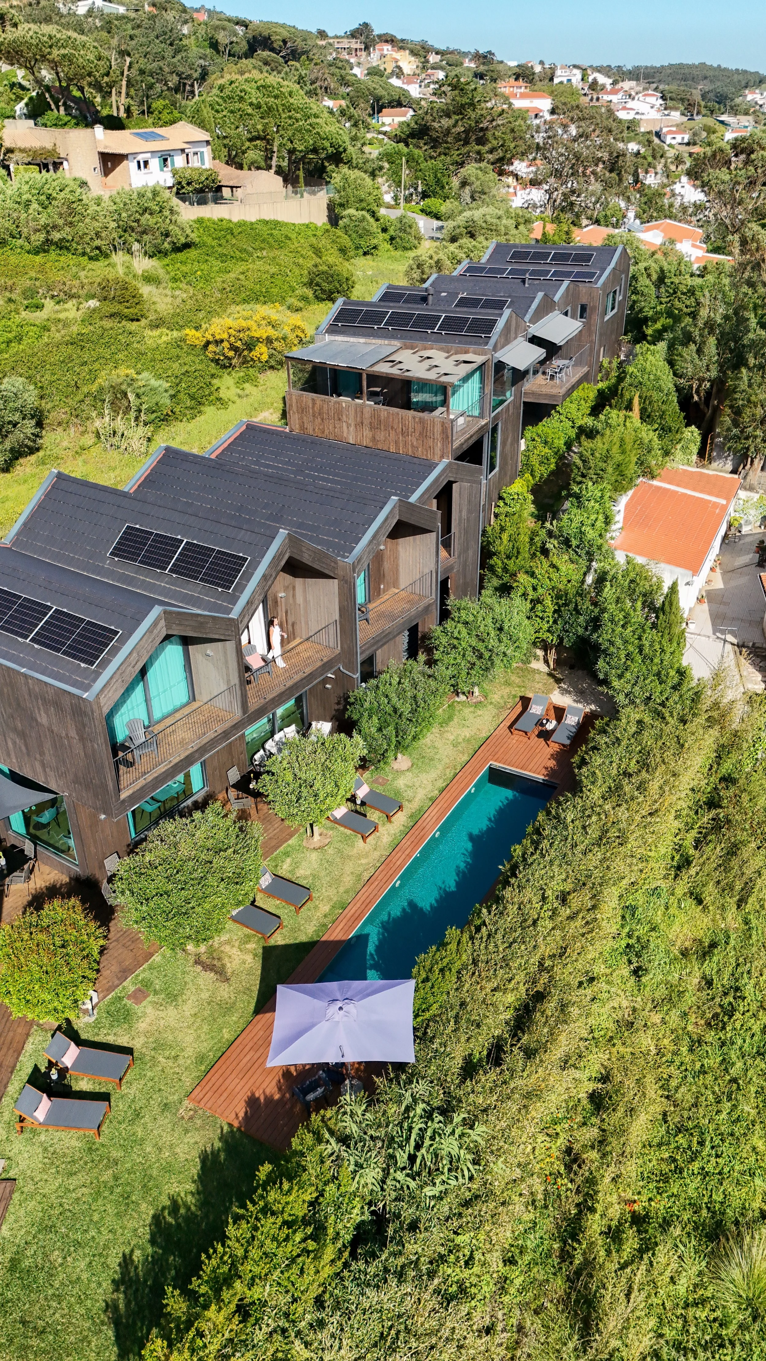 Aerial view of eco-designed villas with private gardens and pool at Dream Guincho, Guincho