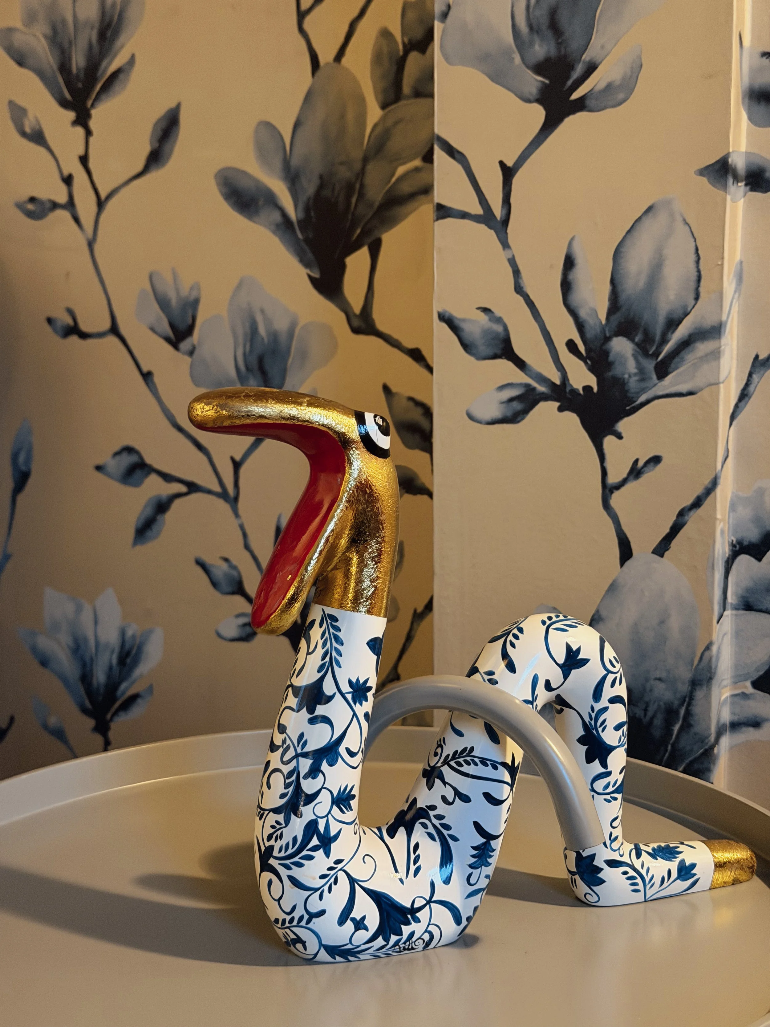 Handcrafted decorative swan faucet with elegant blue floral details