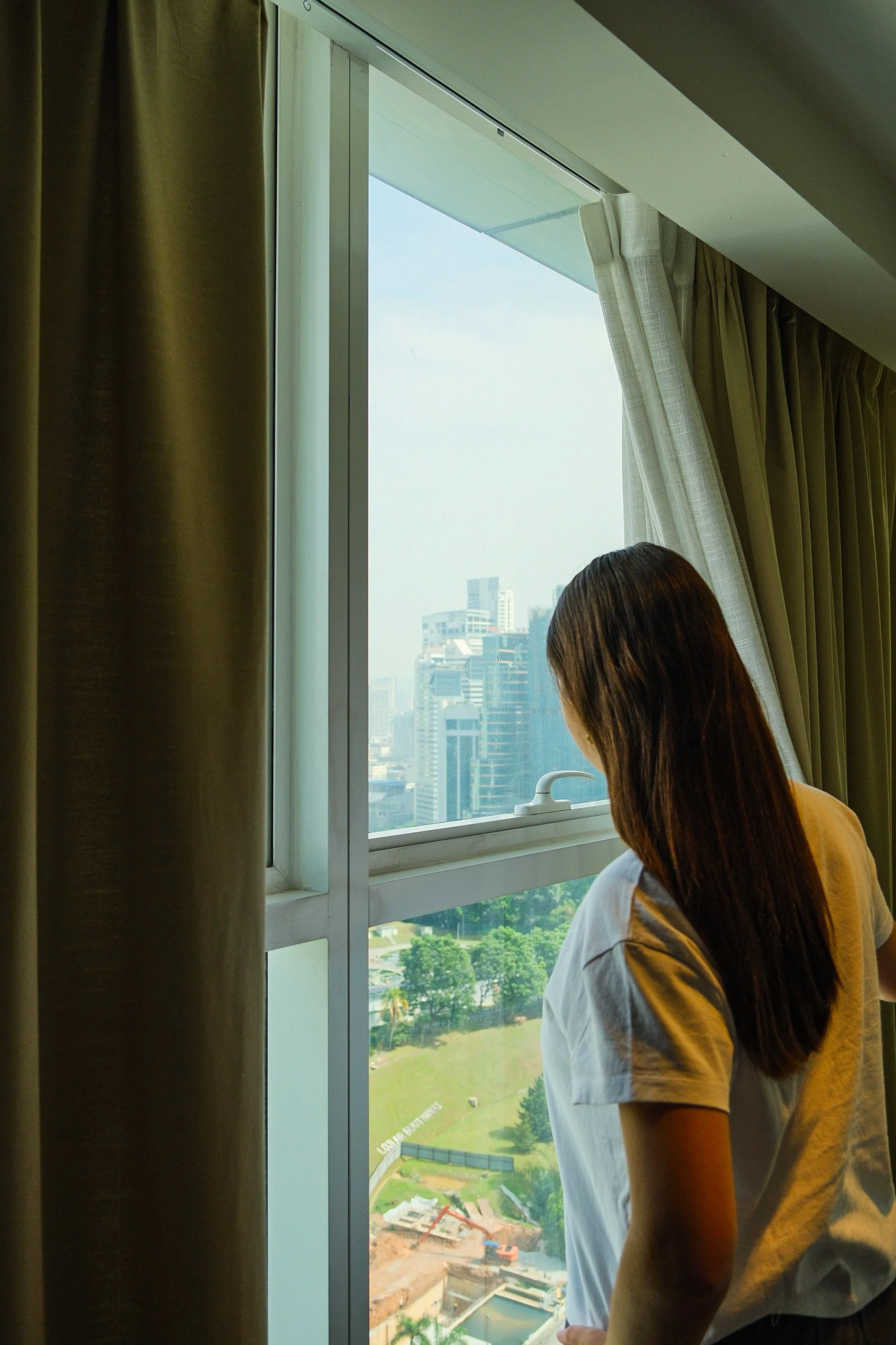 Enjoying panoramic skyline views from the suite window