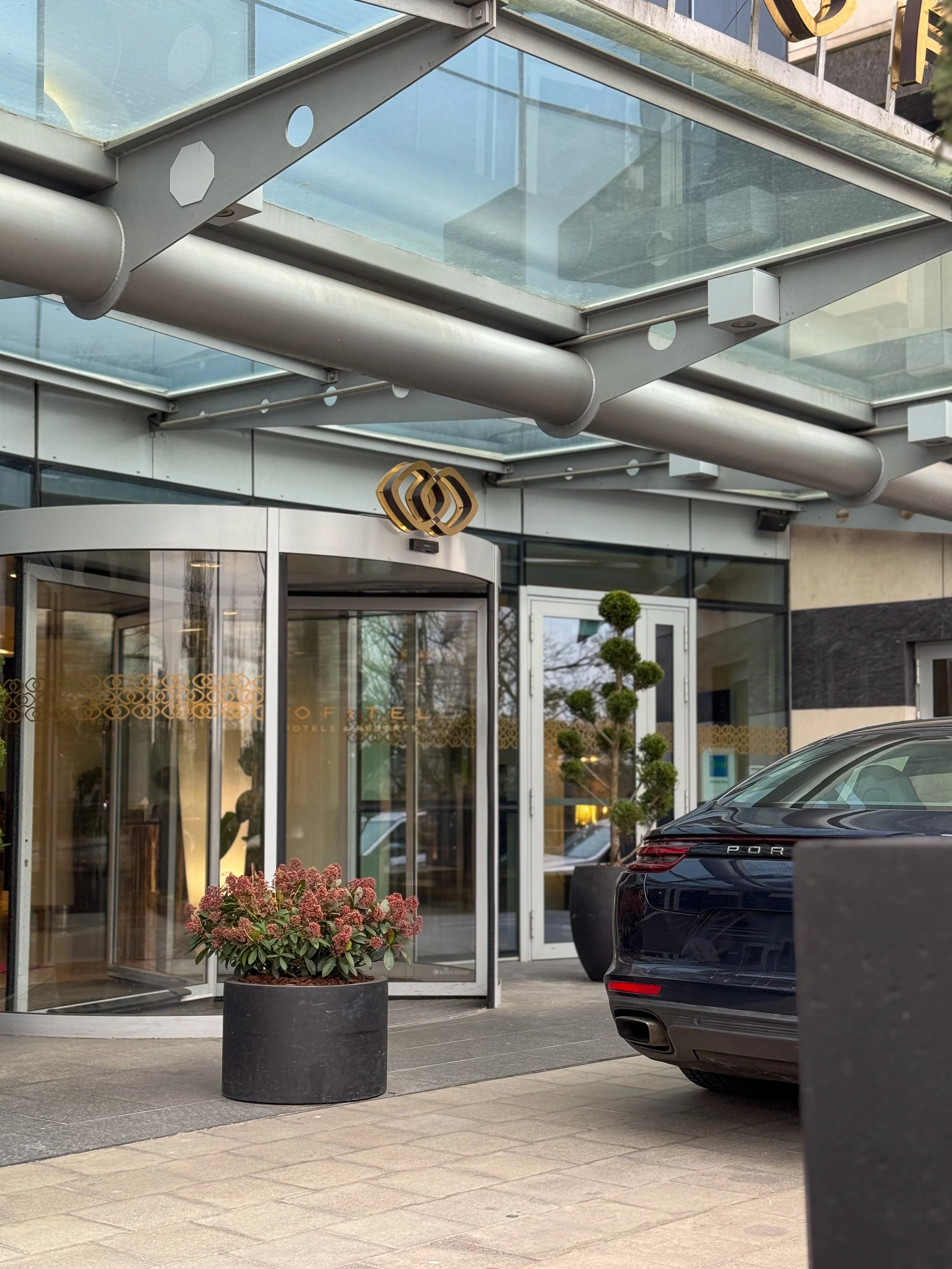 Elegant entrance of Sofitel Le Grand Ducal featuring modern architecture and luxury arrival experience