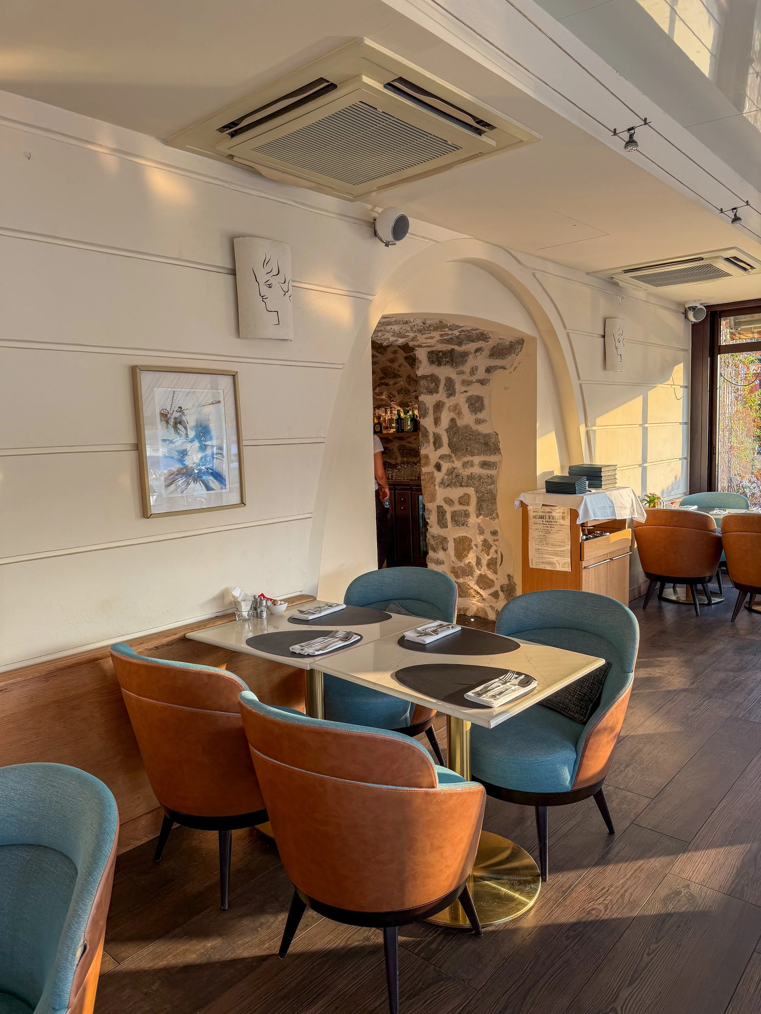 Elegant restaurant combining contemporary dining with historic stone architecture