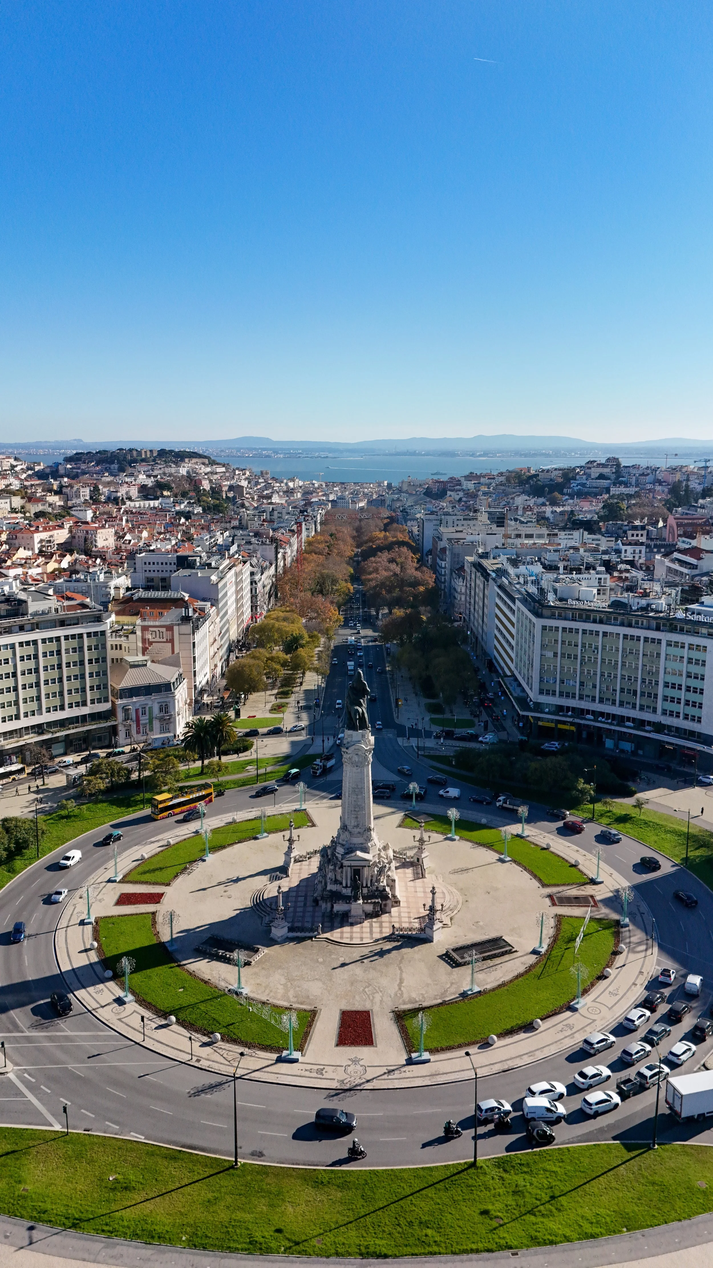 Panoramic aerial view over Marquis of Pombal Square, Avenida da Liberdade, and the Tagus River
