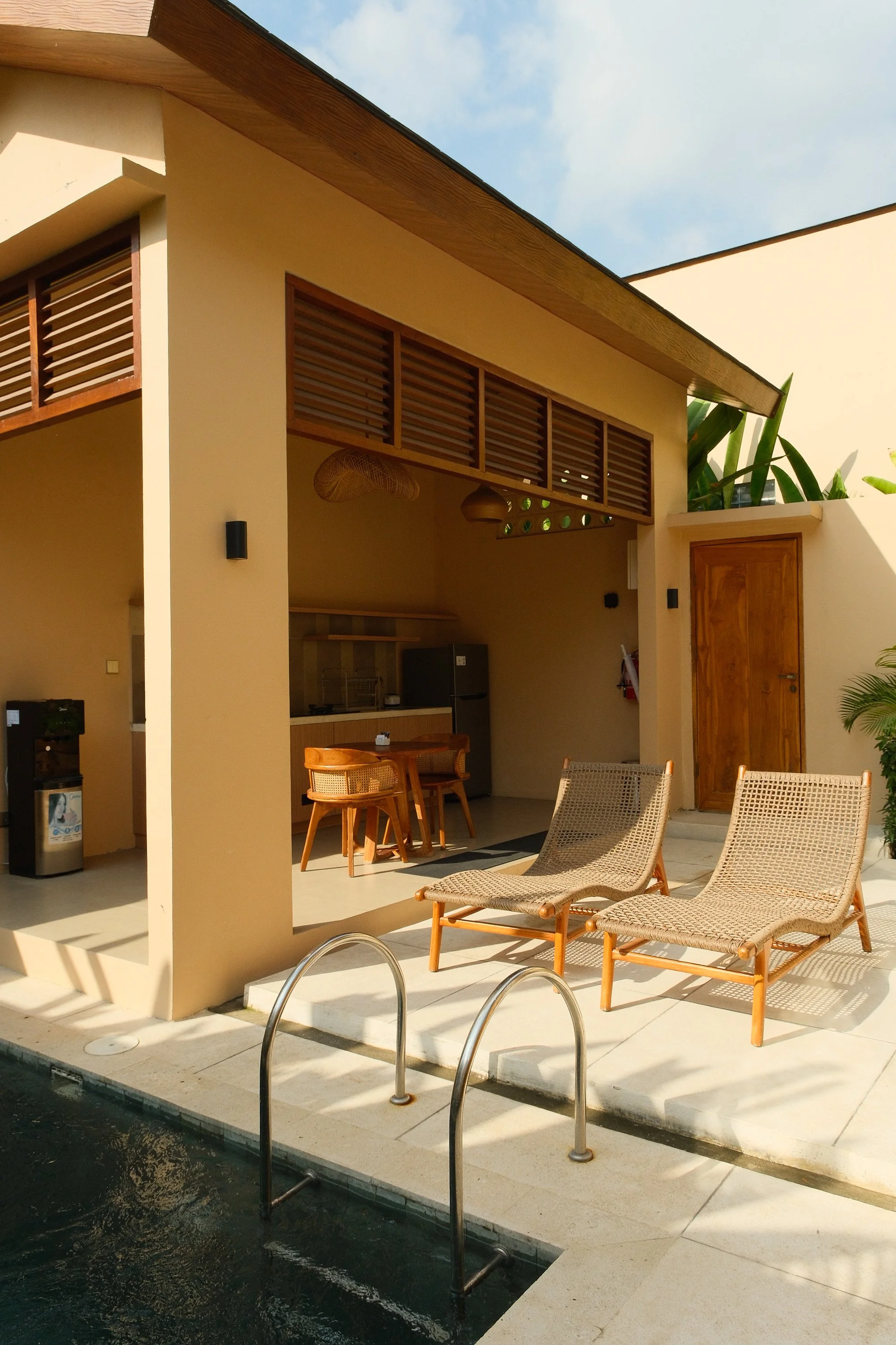 Open air lounge and dining area overlooking the private pool