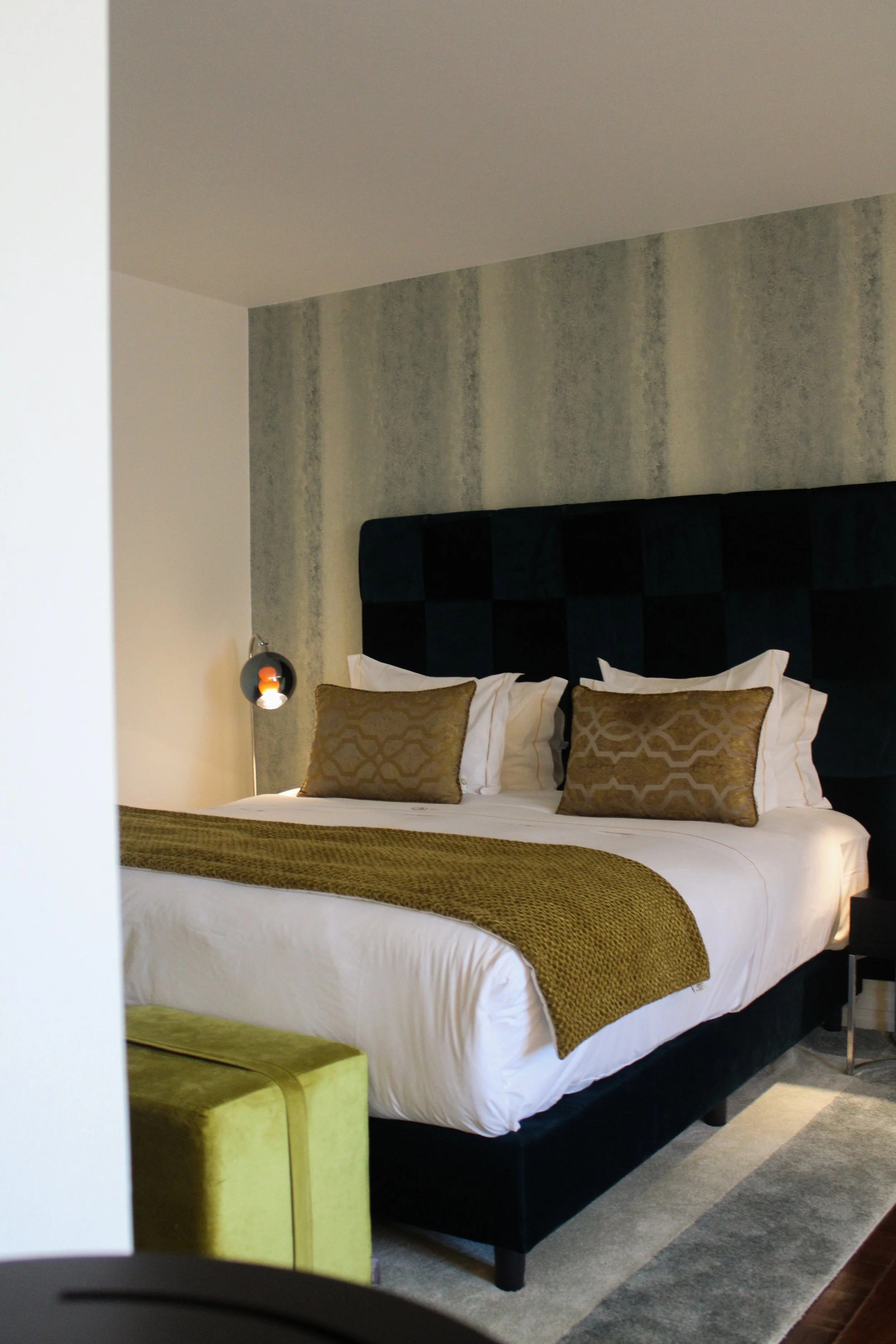 Contemporary bedroom with refined textures and luxury details at Convento do Seixo in Portugal