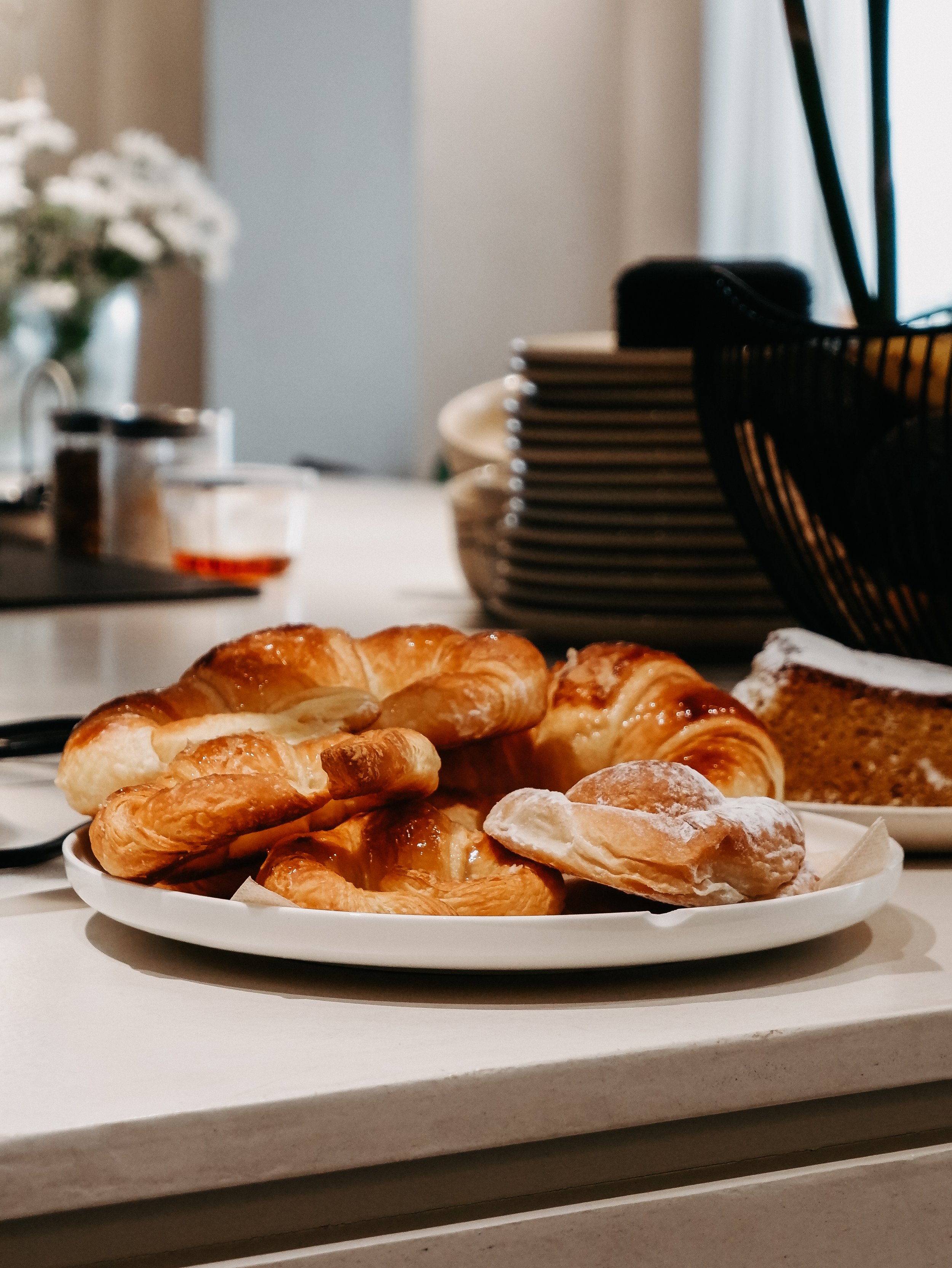 Freshly baked pastries served for breakfast with artisan cakes and seasonal selections
