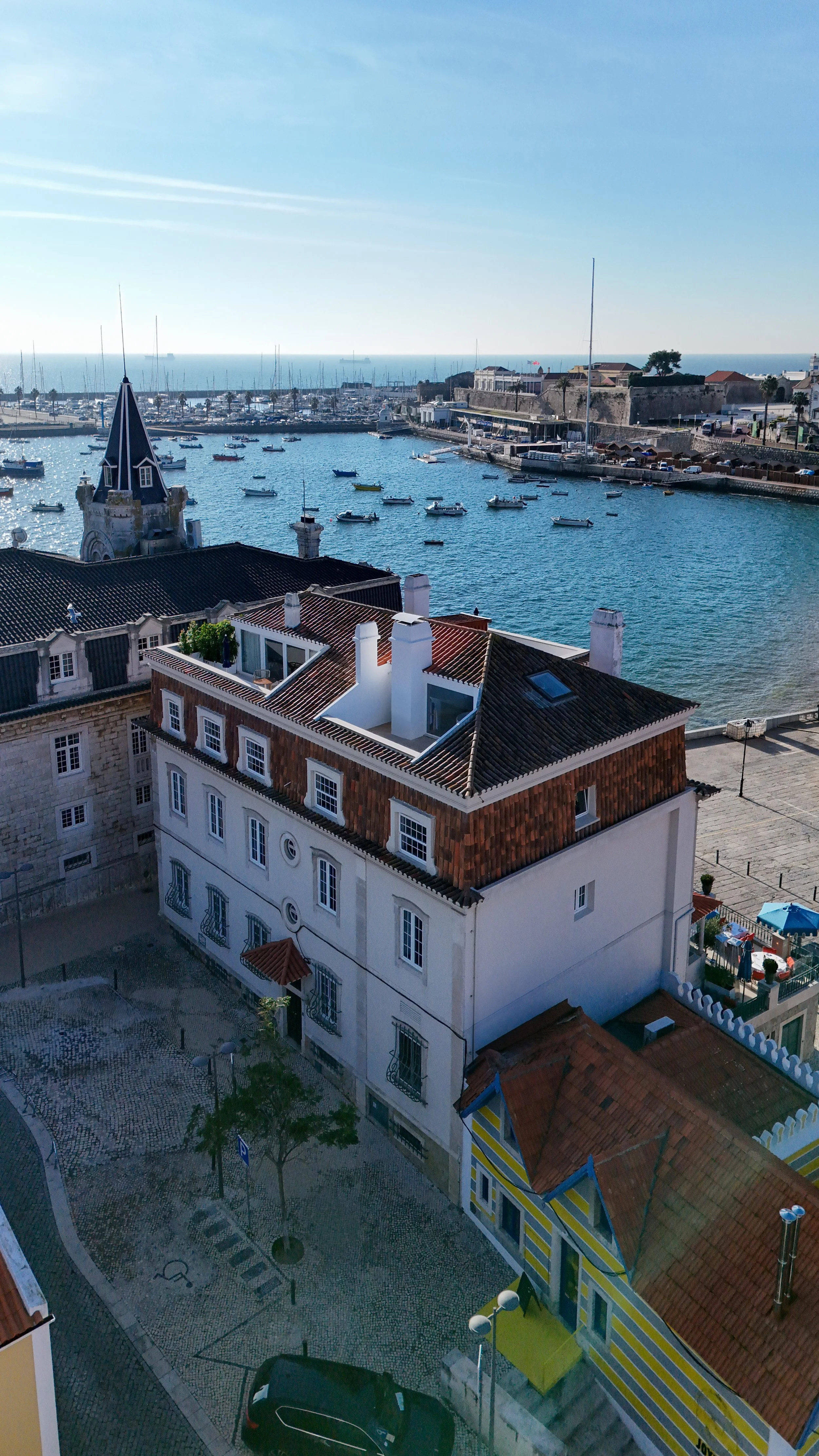 Aerial view of Villa Cascais Boutique Hotel beside Cascais Marina and the Atlantic coastline