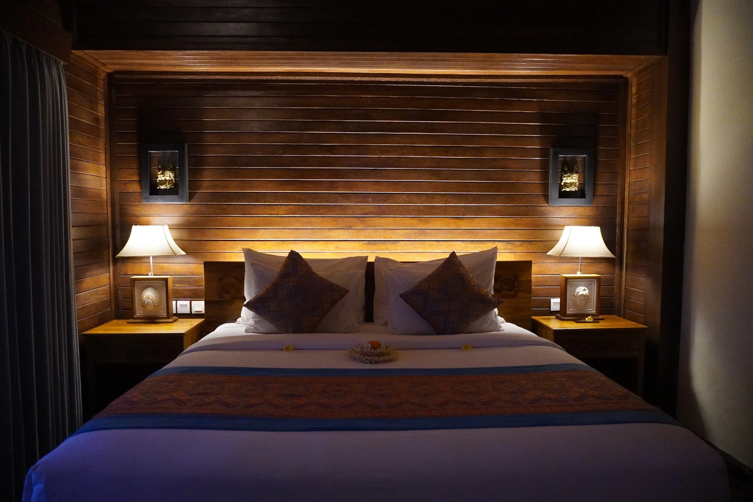 Warm wooden boutique suite with handcrafted Balinese design and ambient lighting
