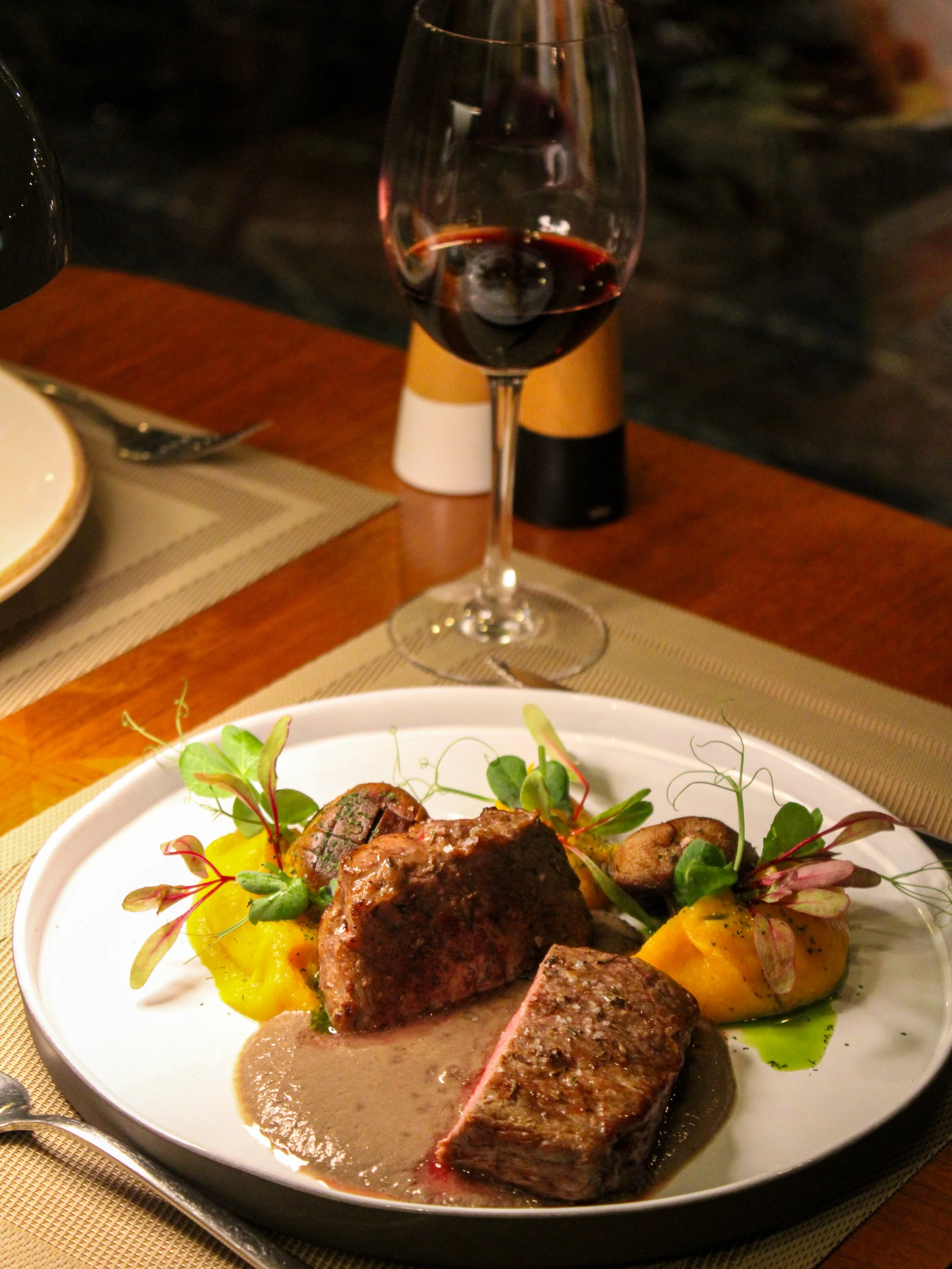 Fine dining dish featuring premium beef, seasonal vegetables, and carefully crafted presentation