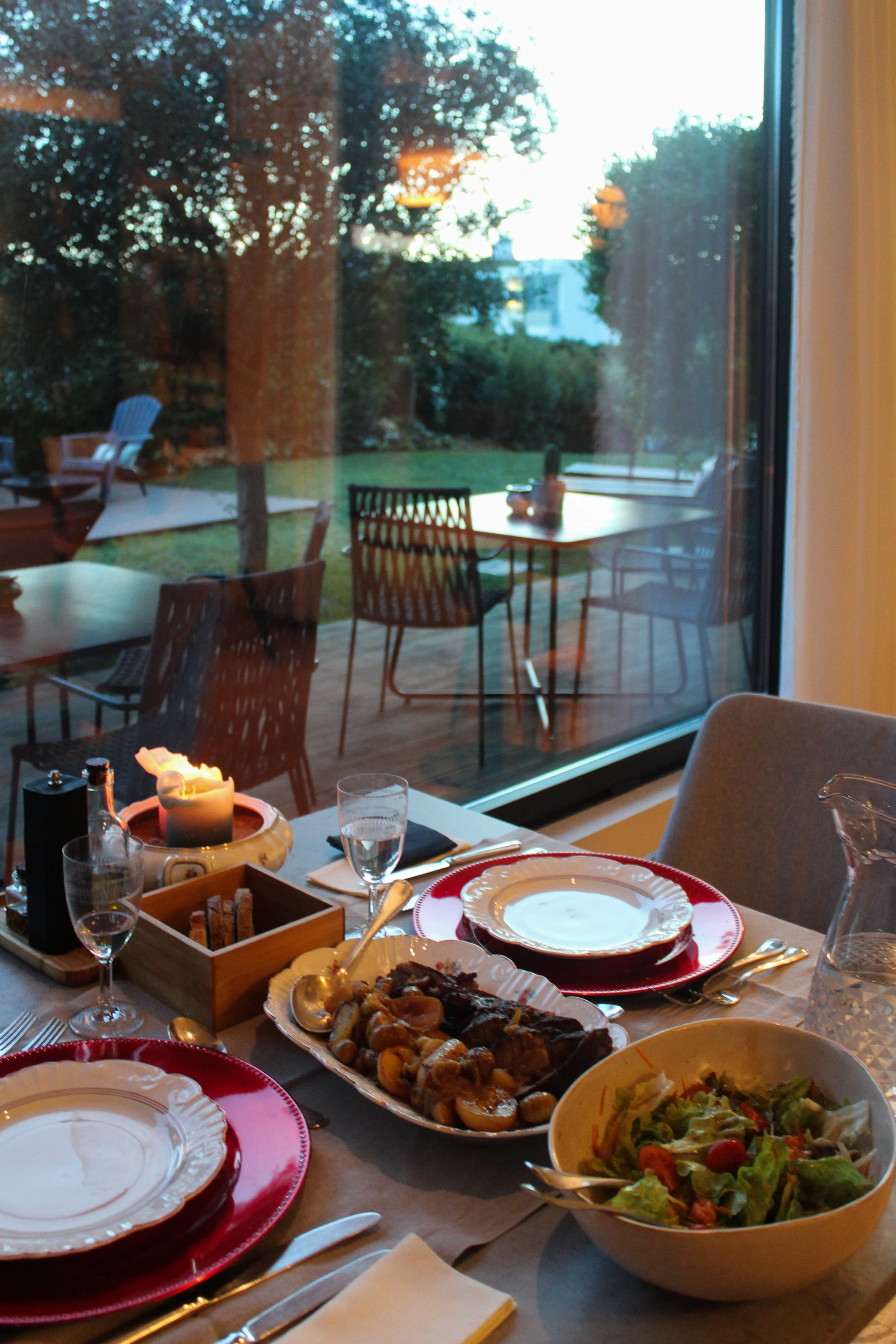 Intimate dining experience with candlelight and garden views at Dream Guincho