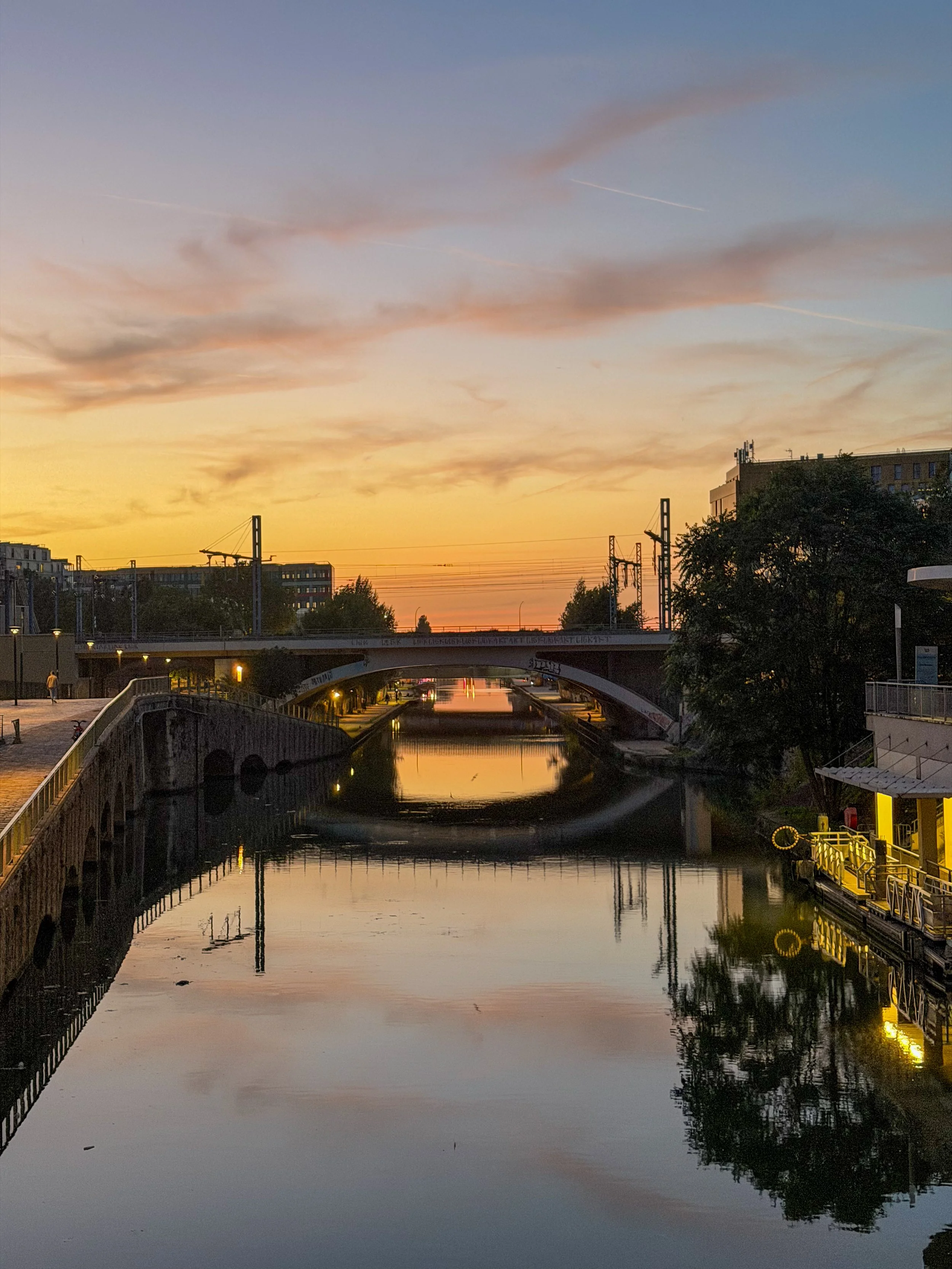 Sunset reflections along Canal de l’Ourcq beside Moxy Paris La Villette in Paris