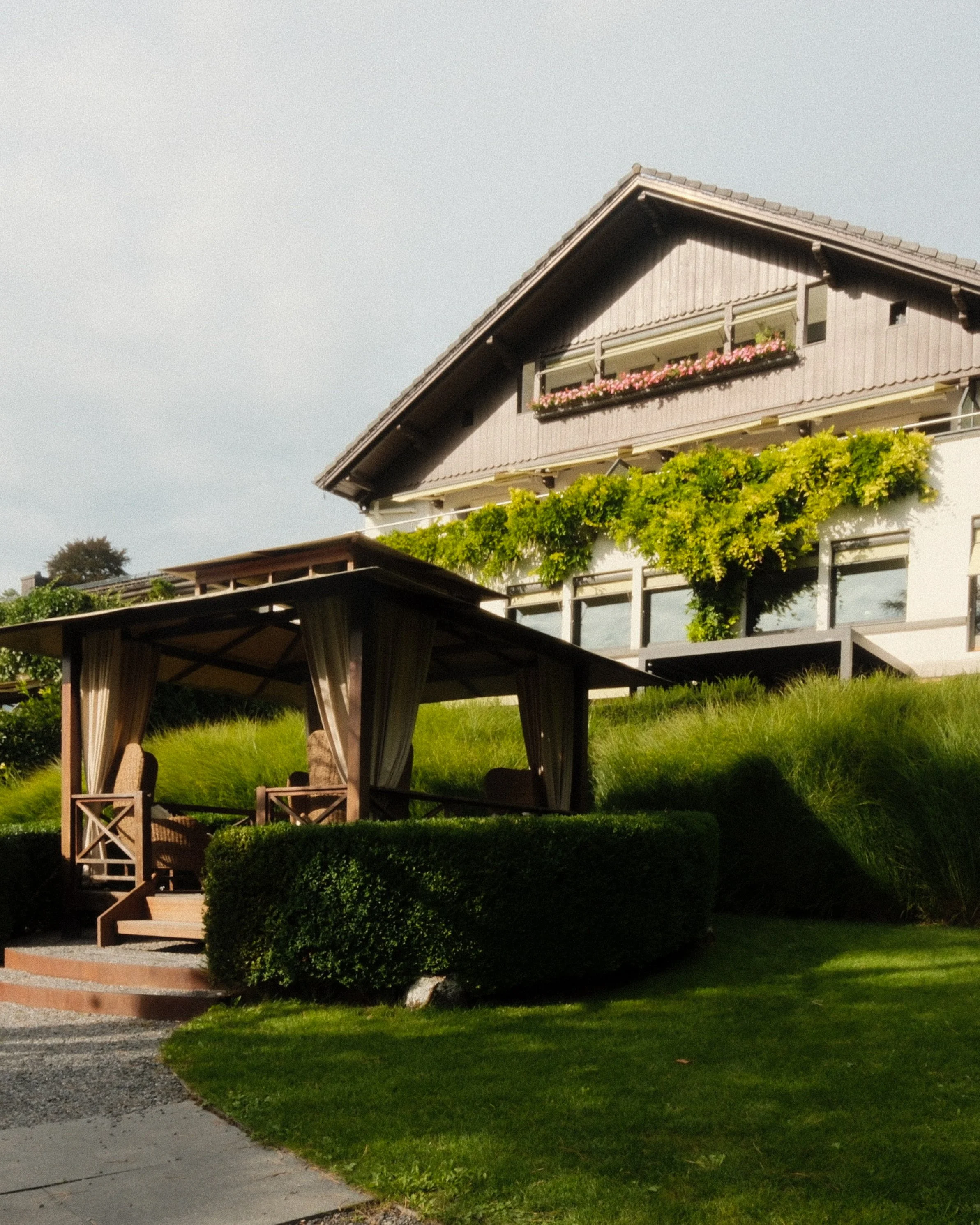 Private garden pavilion nestled within peaceful landscaped grounds