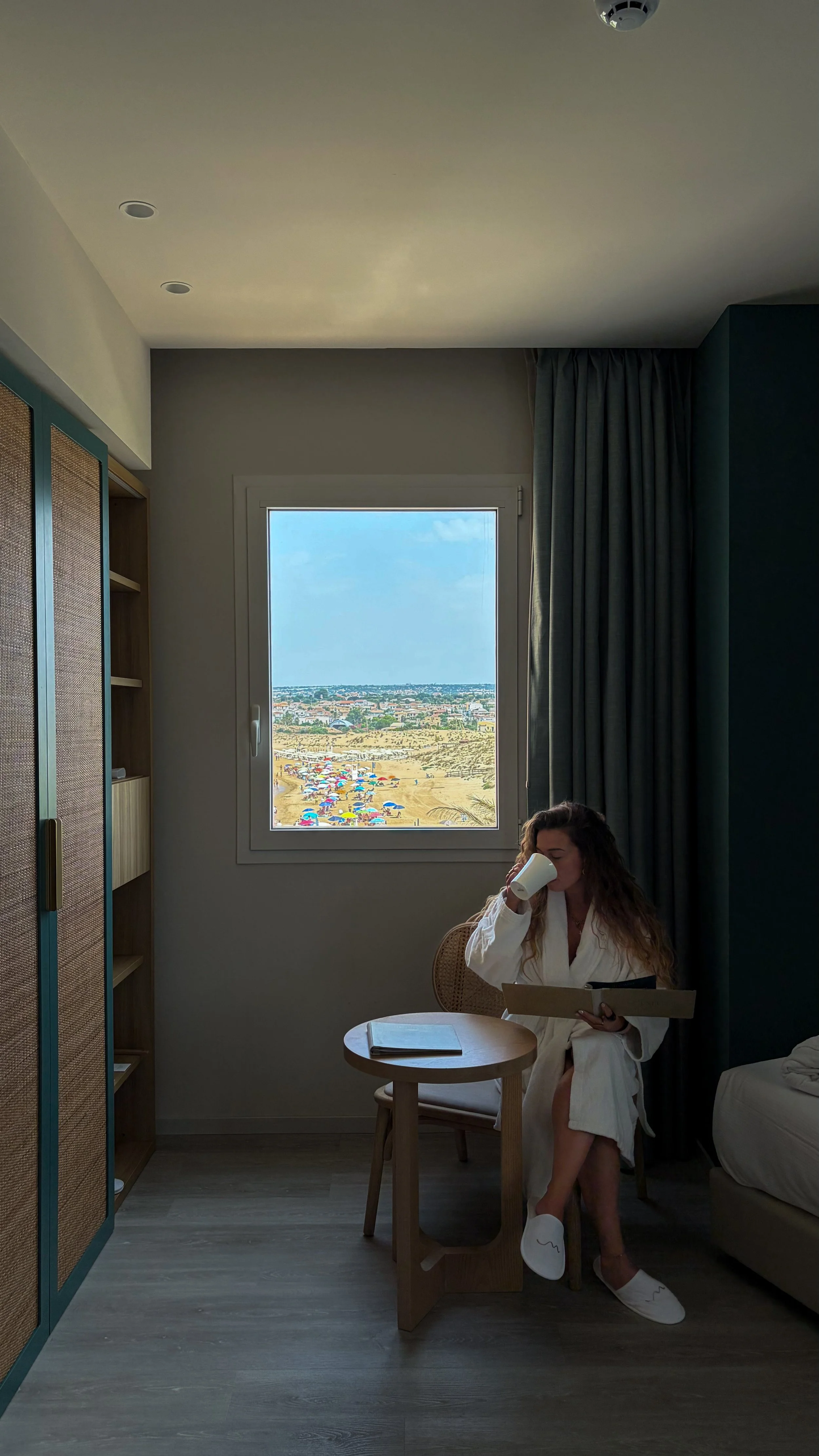 Elegant guest room designed for relaxing mornings overlooking the Sicilian coastline