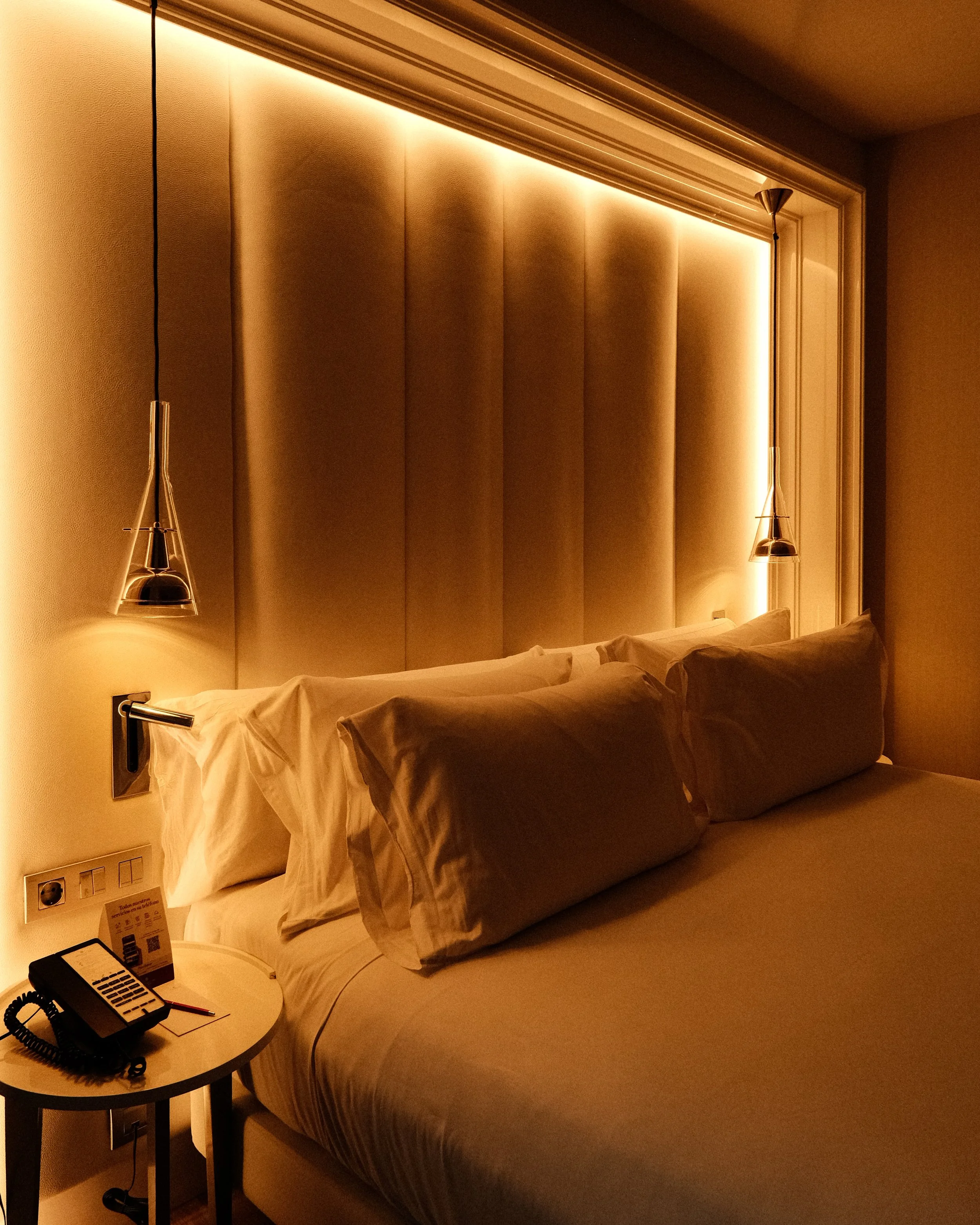 Elegant guest room with warm ambient lighting and contemporary design