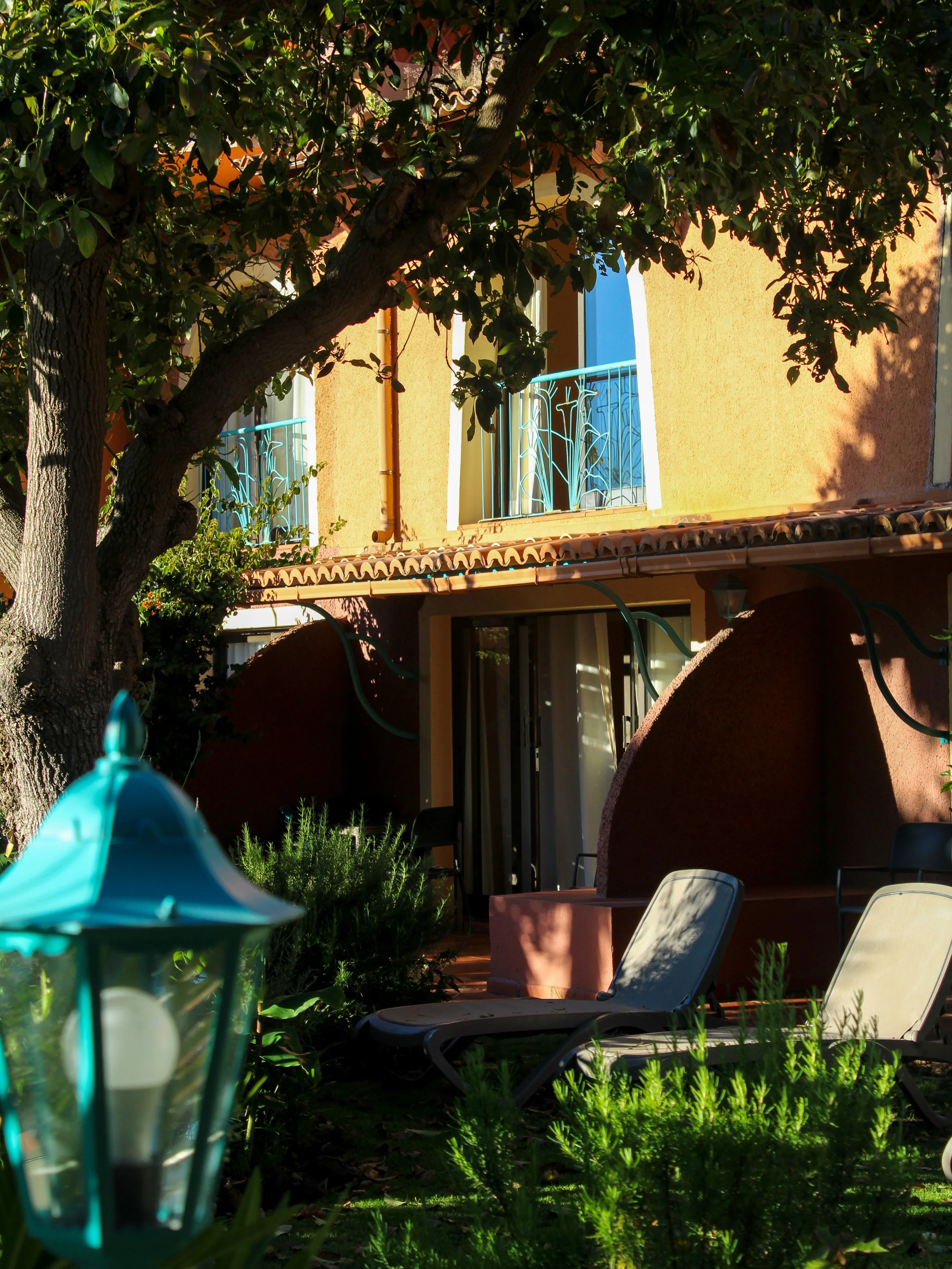 Garden-facing guest accommodation surrounded by lush tropical landscaping and peaceful terraces
