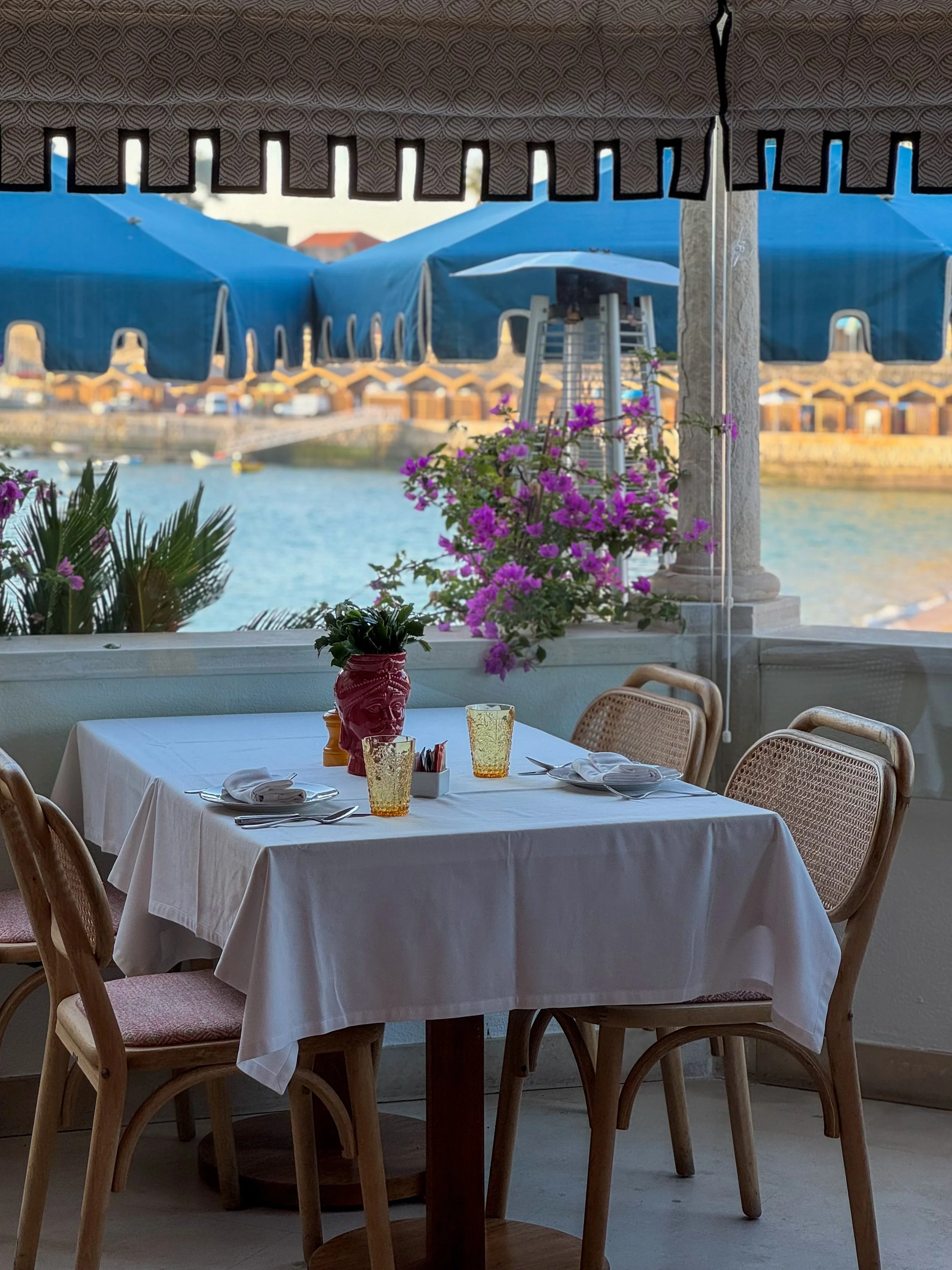 Terrace dining overlooking Cascais Marina with coastal views and boutique hotel charm