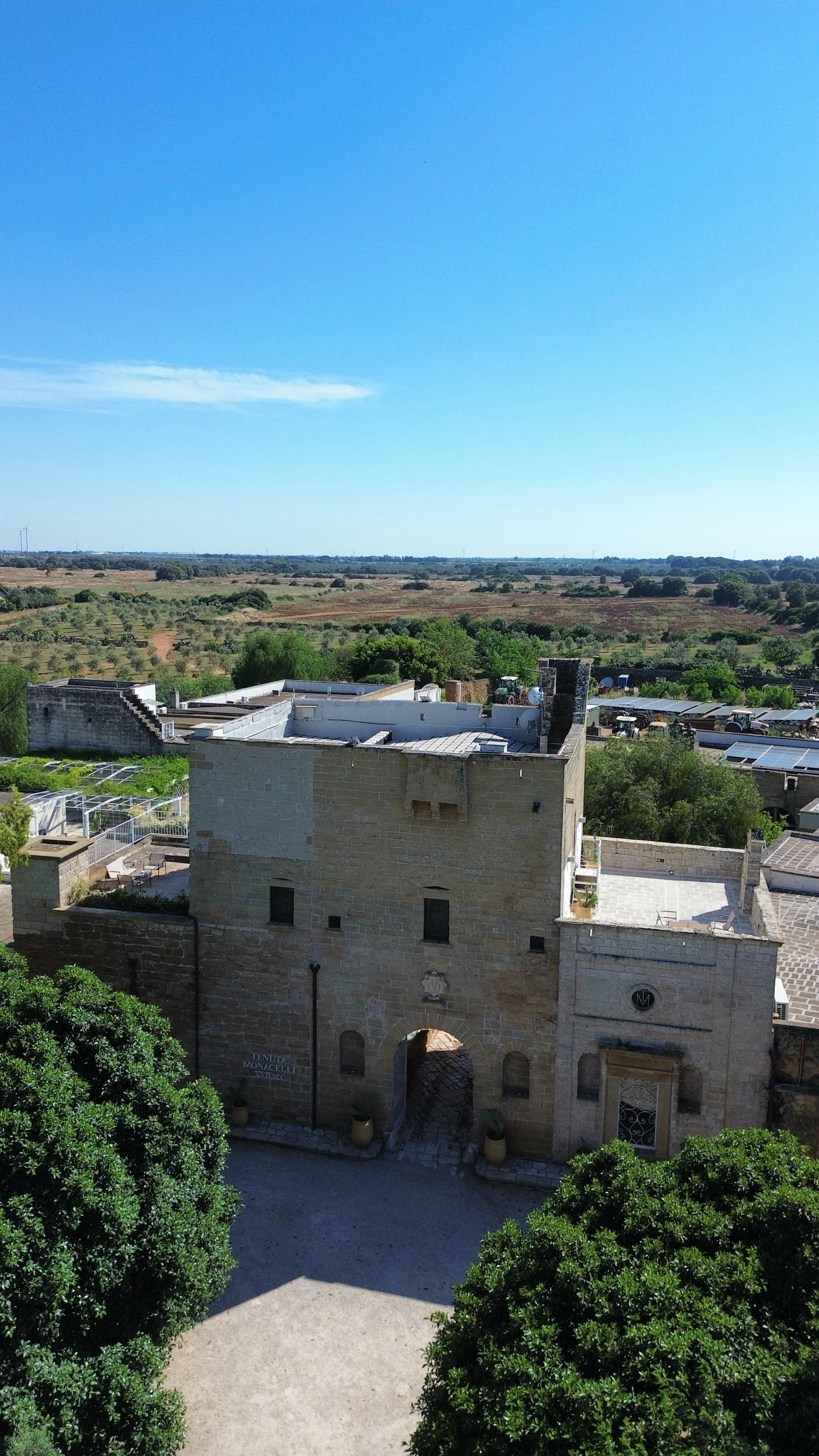 Historic entrance tower surrounded by the Salento countryside at Tenuta Monacelli Lecce, Lecce, Italy