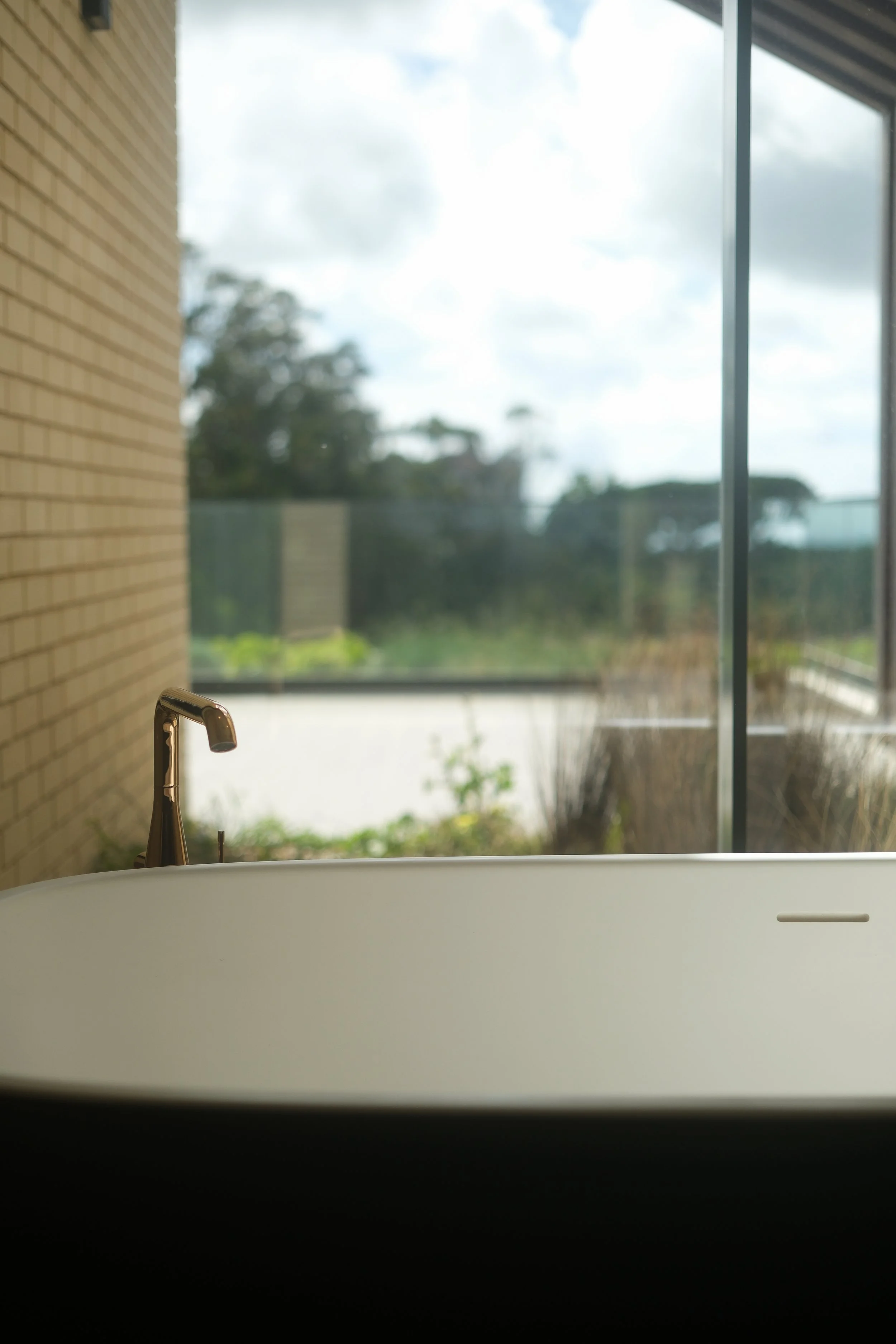 Minimalist bathtub with garden views at Quinta da Maquia Spa & Wellness