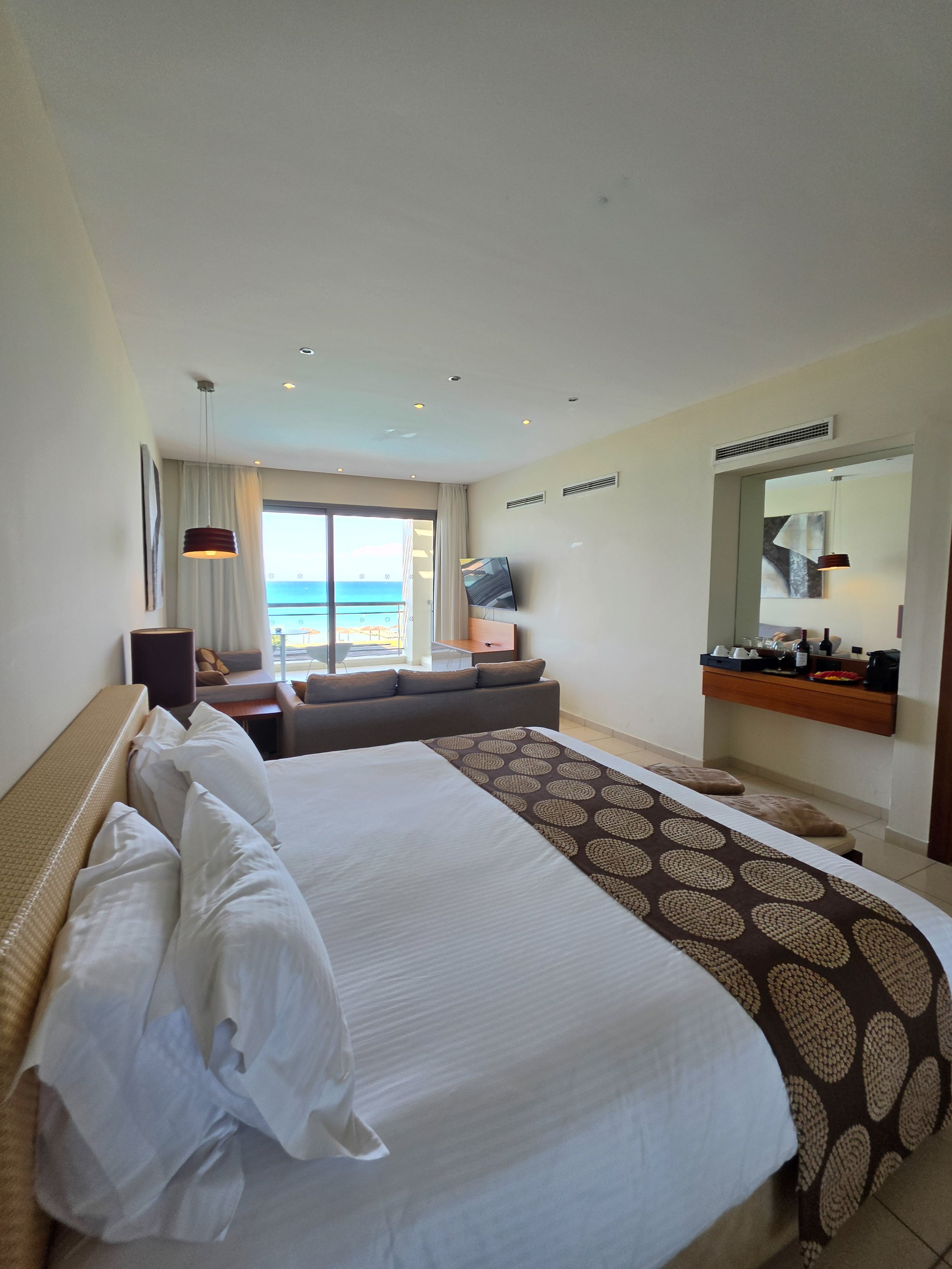 Spacious luxury suite with contemporary interiors and sea view balcony