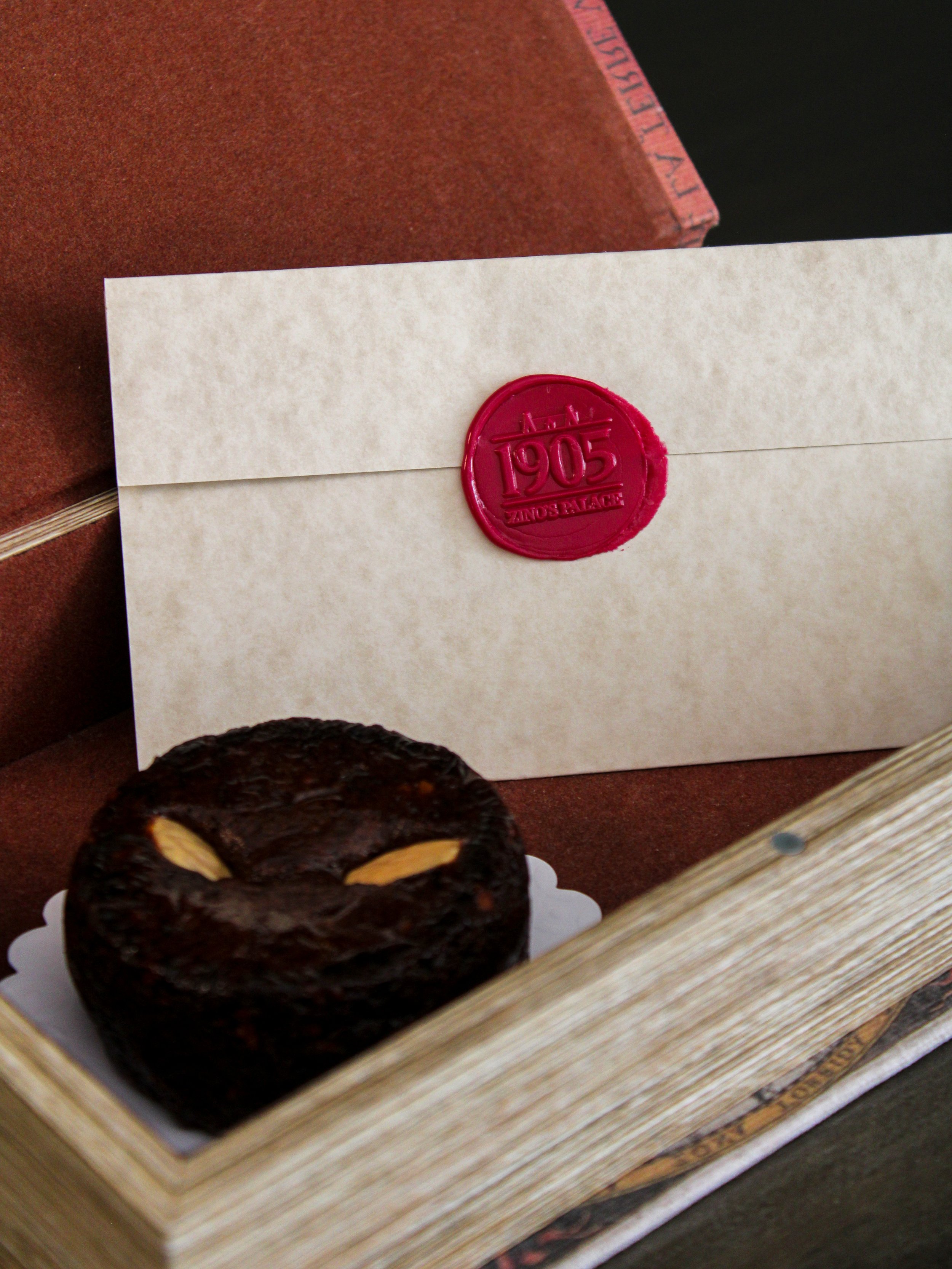 Traditional Madeiran welcome featuring artisan cake, heritage stationery, and a handcrafted wax seal