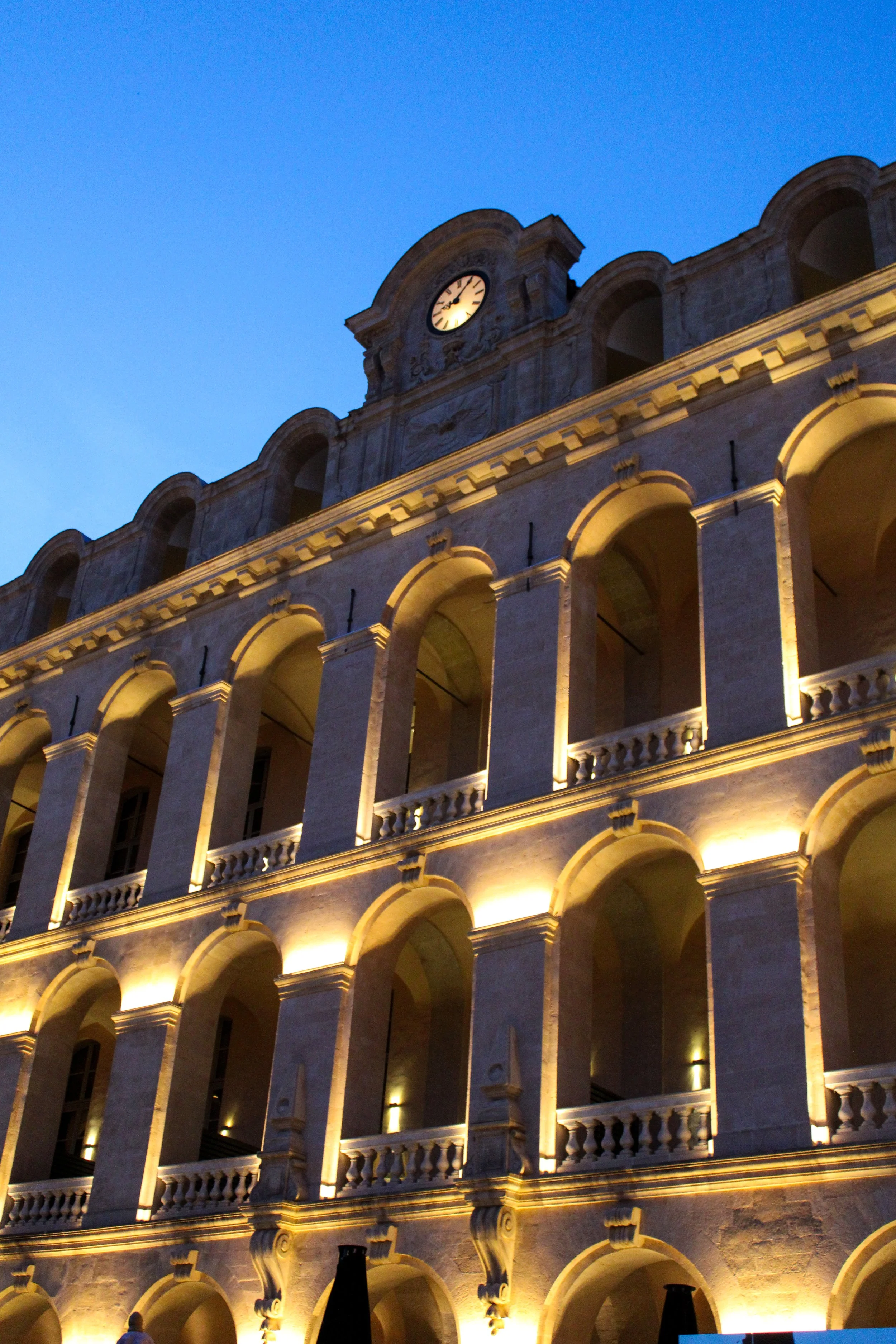 Historic façade beautifully illuminated against the evening sky