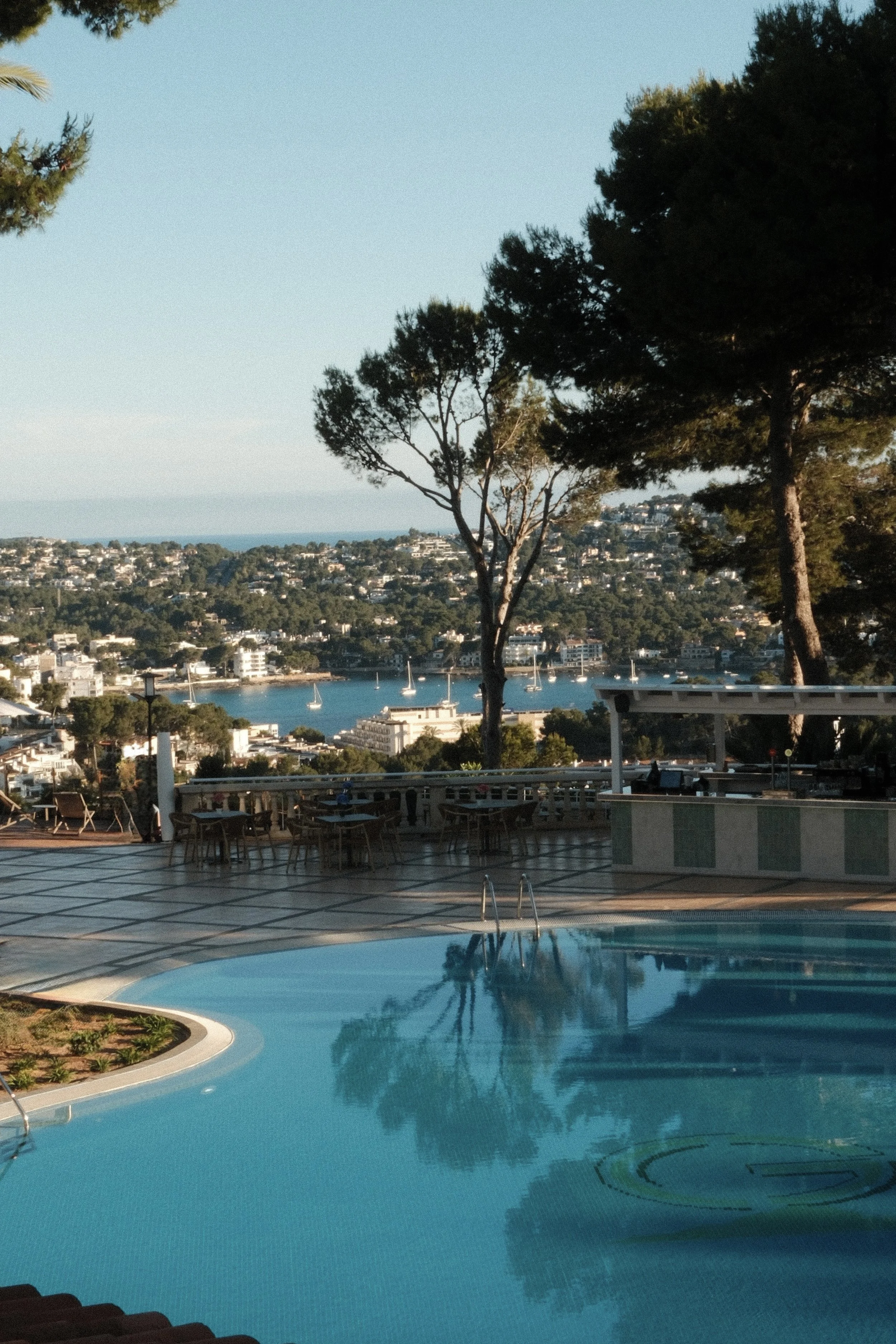 Infinity-style swimming pool with sweeping coastal views across Mallorca’s southwest coastline at Hilton Mallorca Galatzo