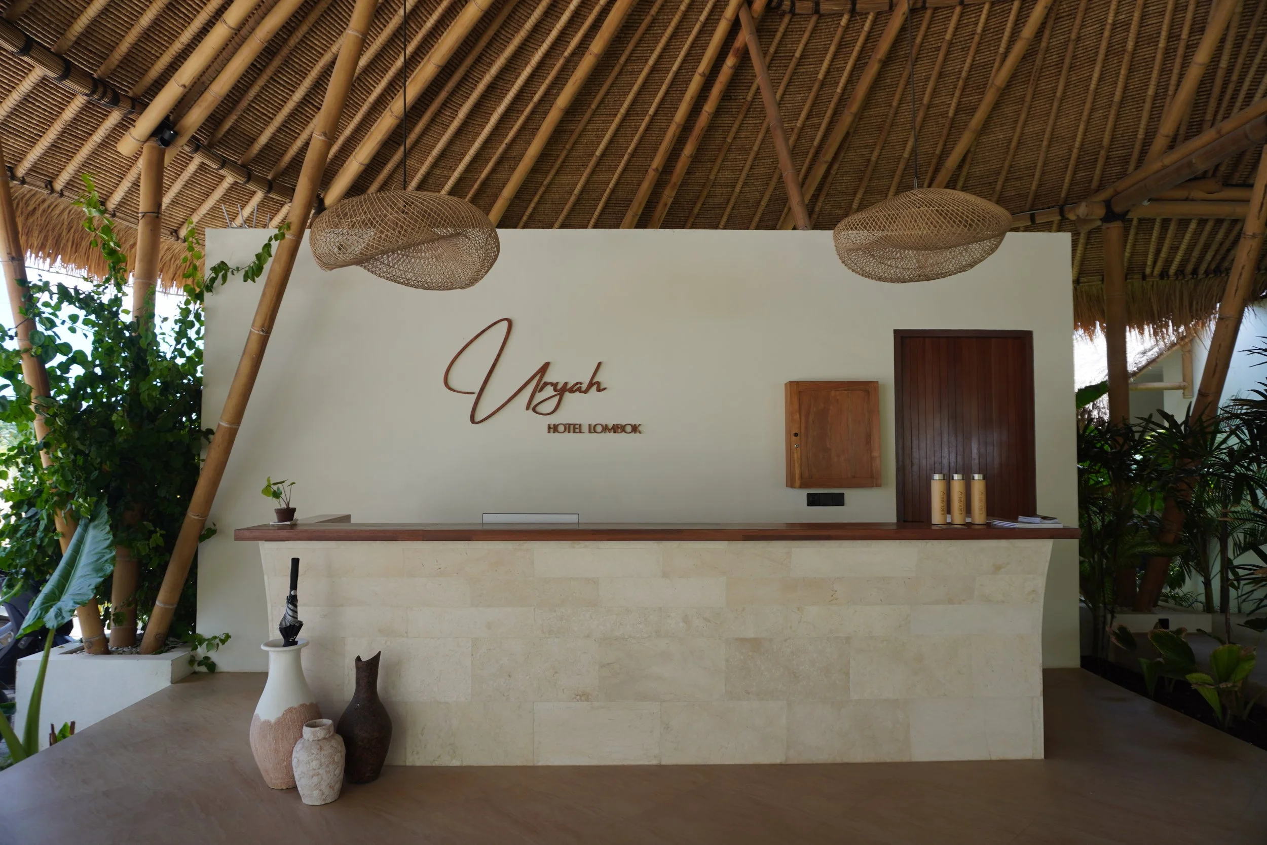 Elegant reception area showcasing contemporary tropical design and natural materials