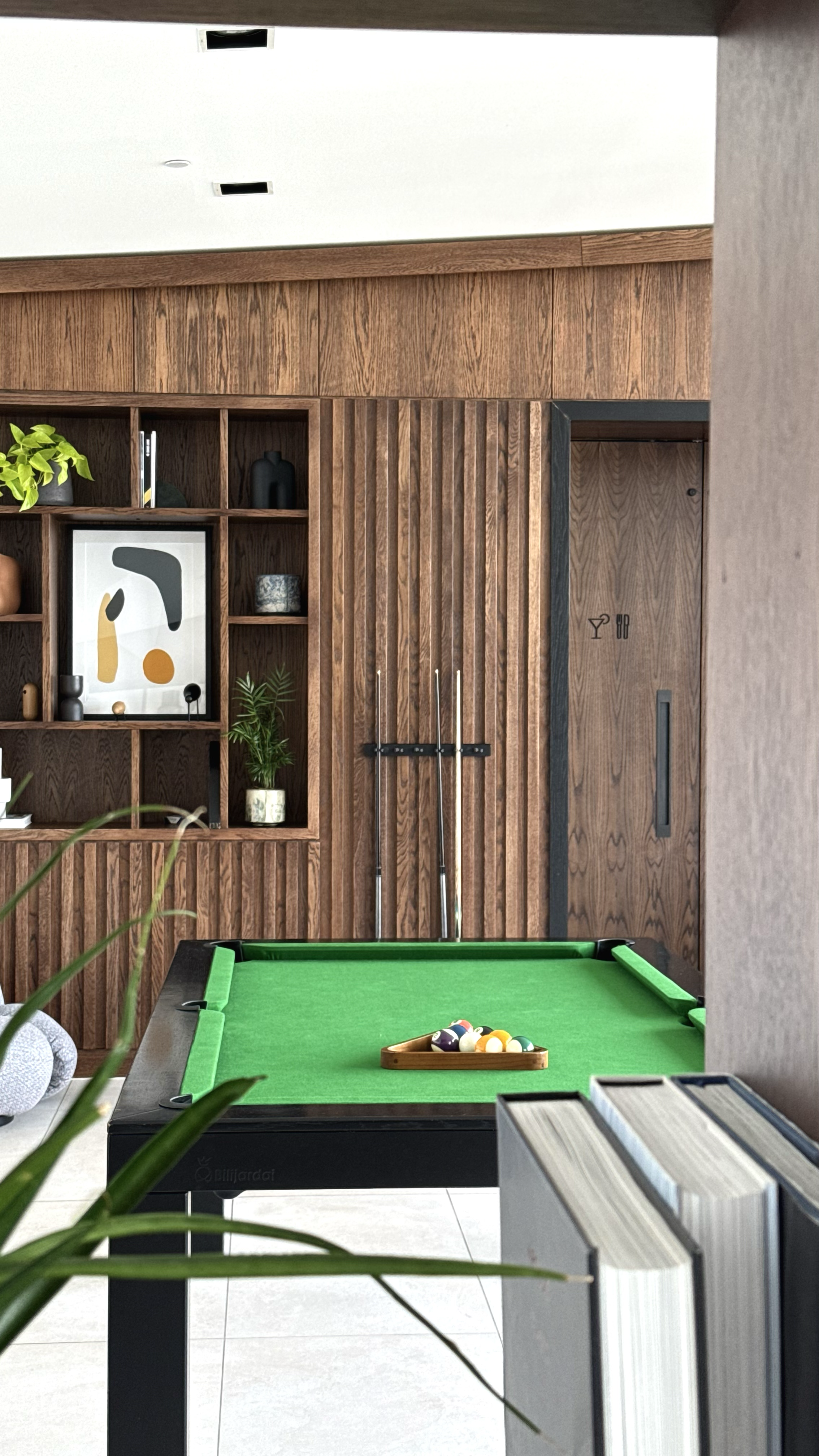 Contemporary games lounge featuring a pool table and modern communal spaces