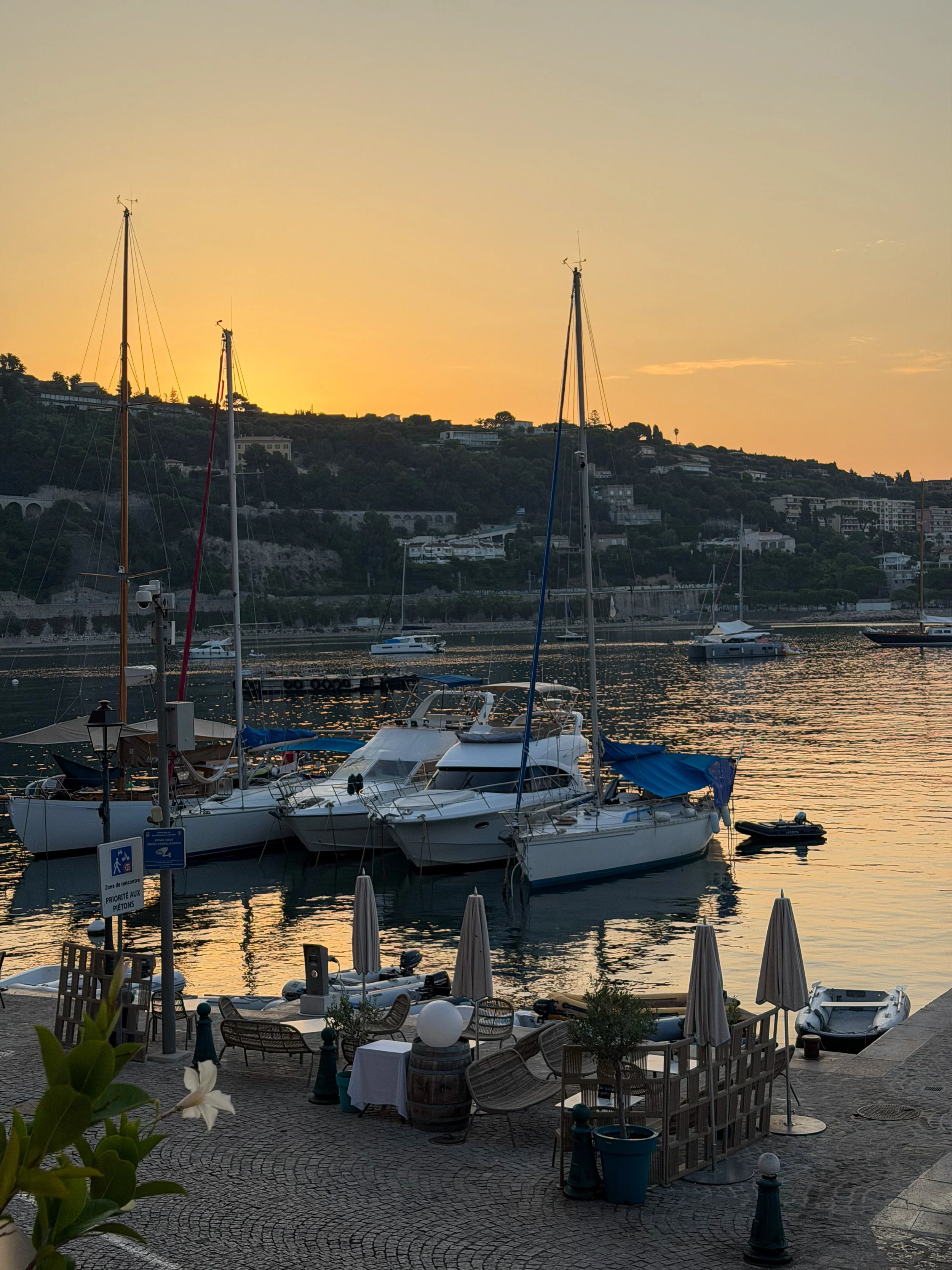 Golden sunset over the marina with yachts gently resting in the bay