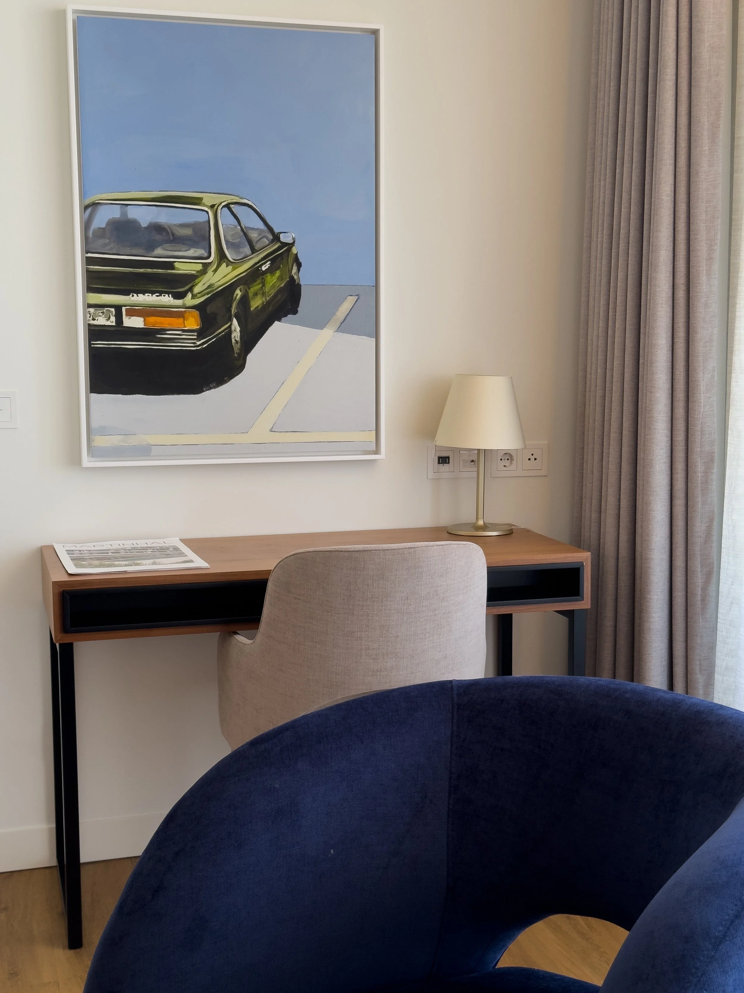 Contemporary hotel workspace with minimalist desk, soft neutral tones, and modern art, offering a stylish and functional stay, Martinhal Lisbon Oriente – Lisbon, Portugal.