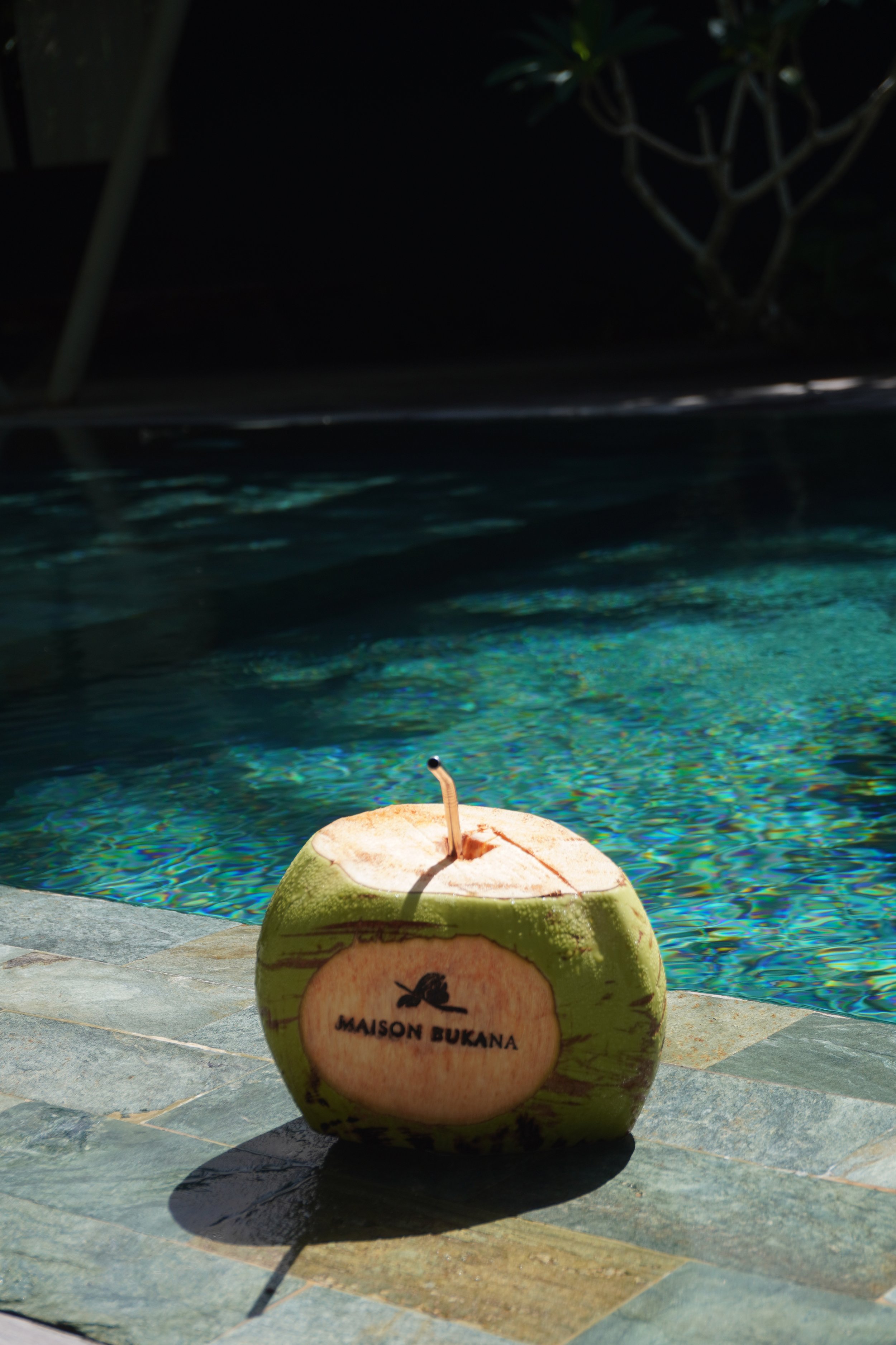 Fresh coconut served beside the swimming pool for a refreshing tropical escape